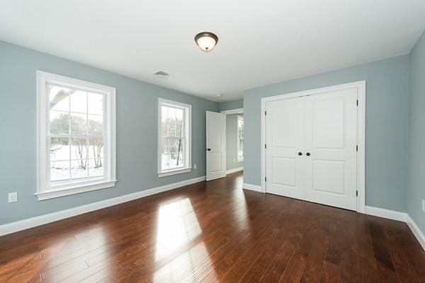 22 Tracywood Road Canton, MA 02021 - Photo 8 of 28 an empty room with wooden floor and windows