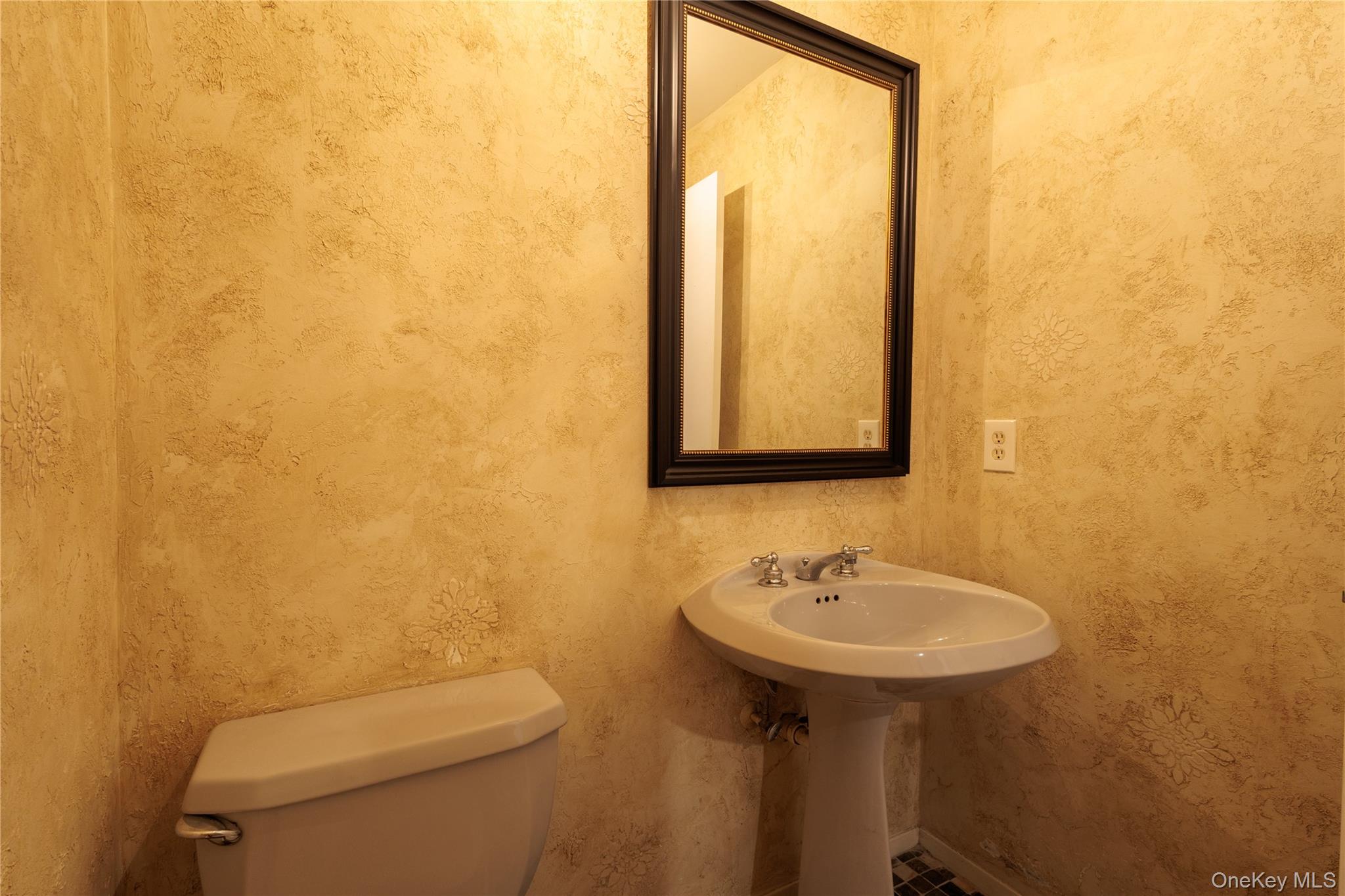 14 Hill Road St. James, NY 11780 - Photo 11 of 29 a bathroom with a sink mirror and toilet