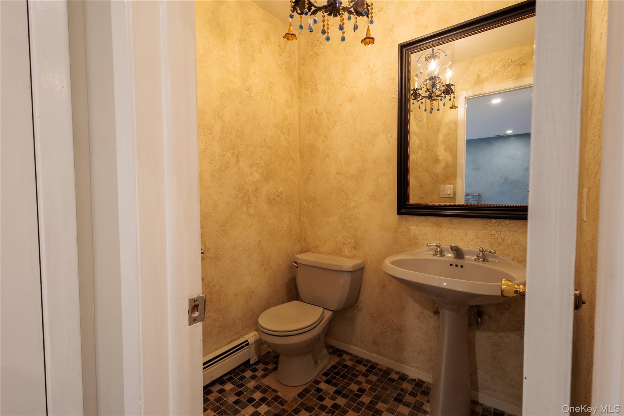 14 Hill Road St. James, NY 11780 - Photo 12 of 29 a bathroom with a toilet sink and mirror