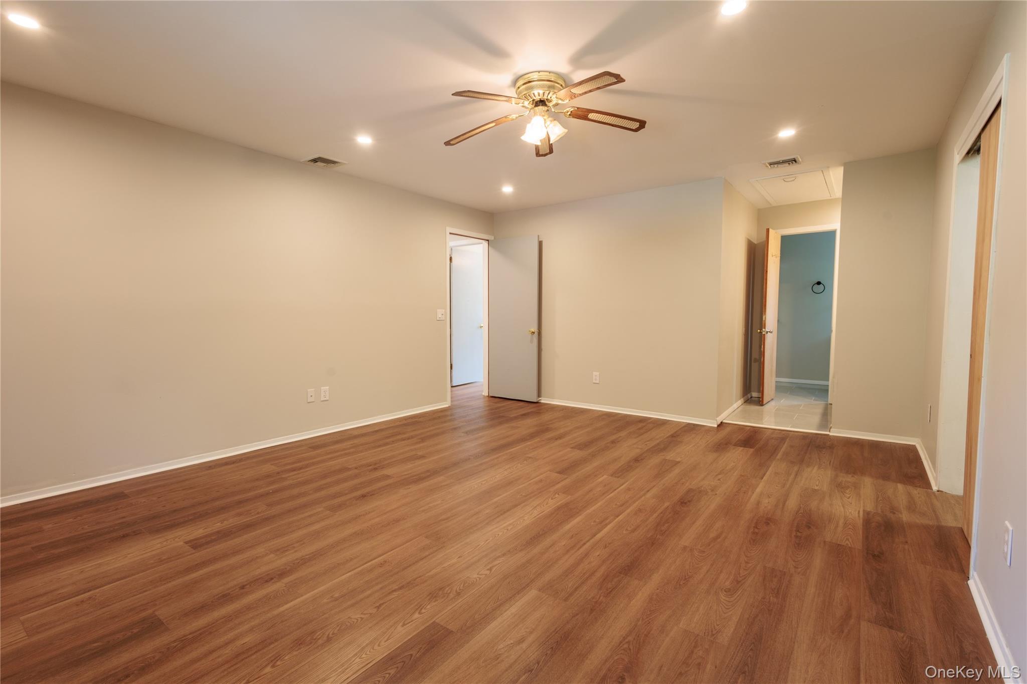 14 Hill Road St. James, NY 11780 - Photo 15 of 29 a view of an empty room with wooden floor