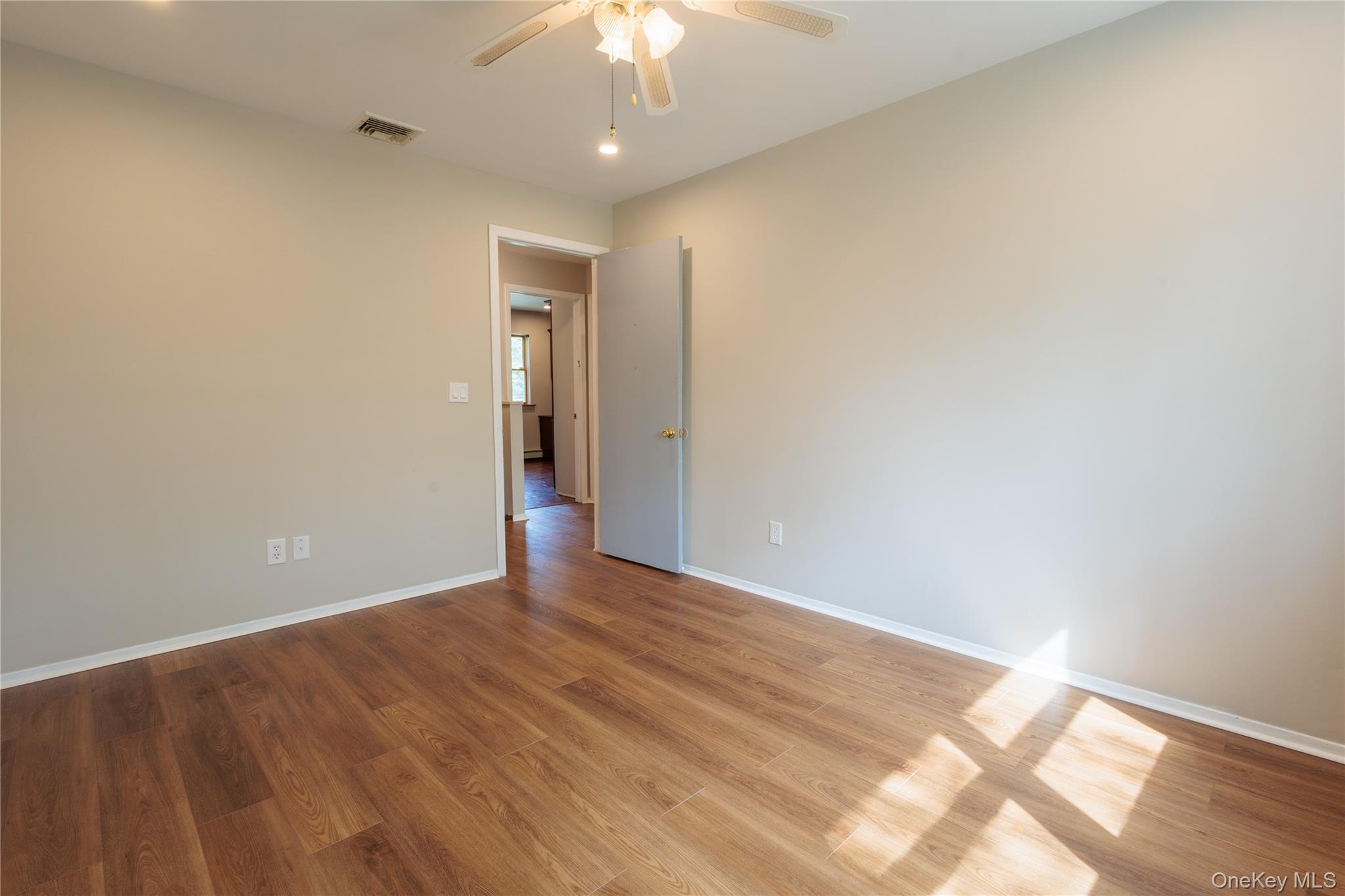 14 Hill Road St. James, NY 11780 - Photo 19 of 29 wooden floor in an empty room