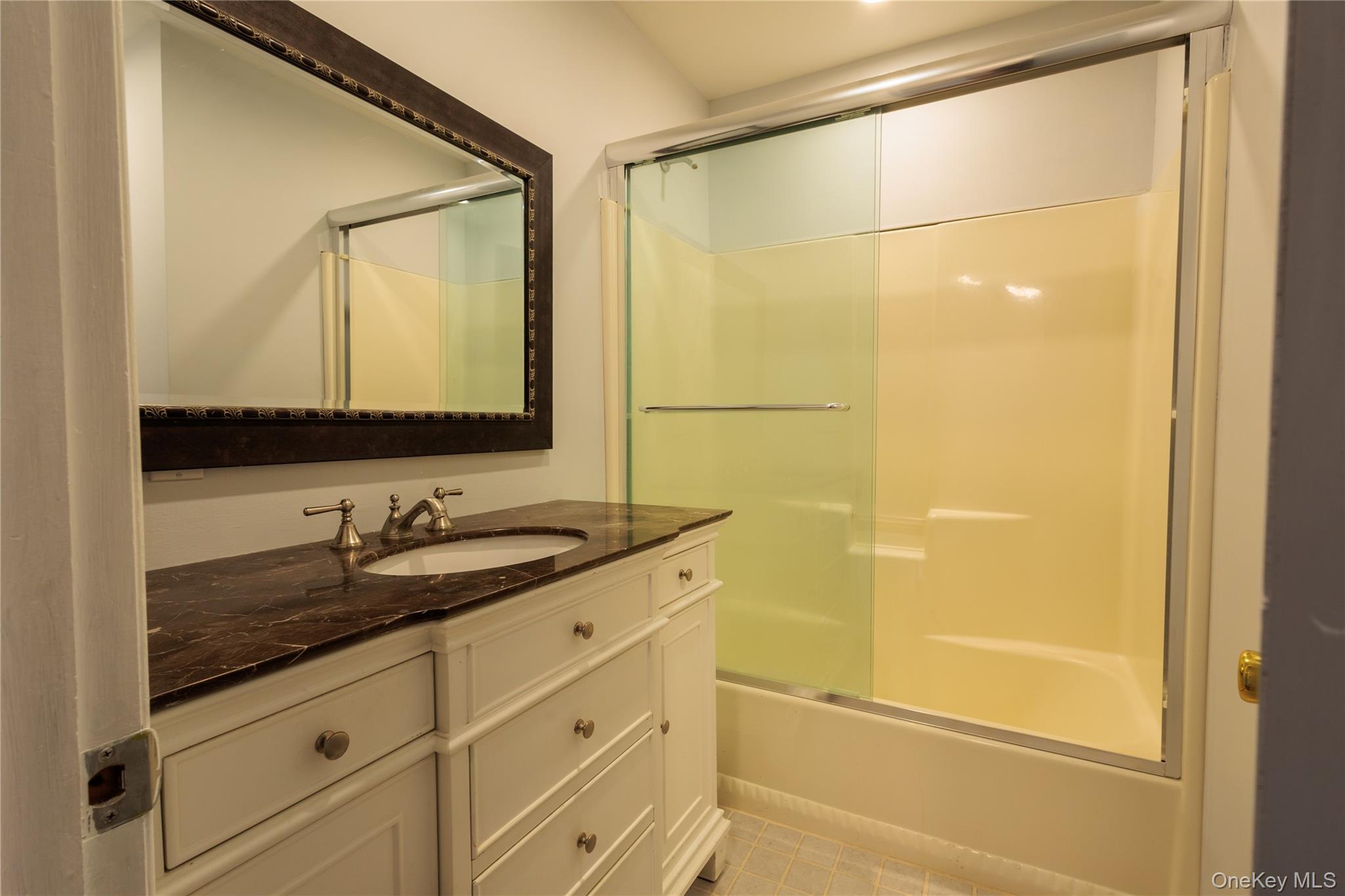 14 Hill Road St. James, NY 11780 - Photo 23 of 29 a bathroom with a granite countertop sink mirror and a