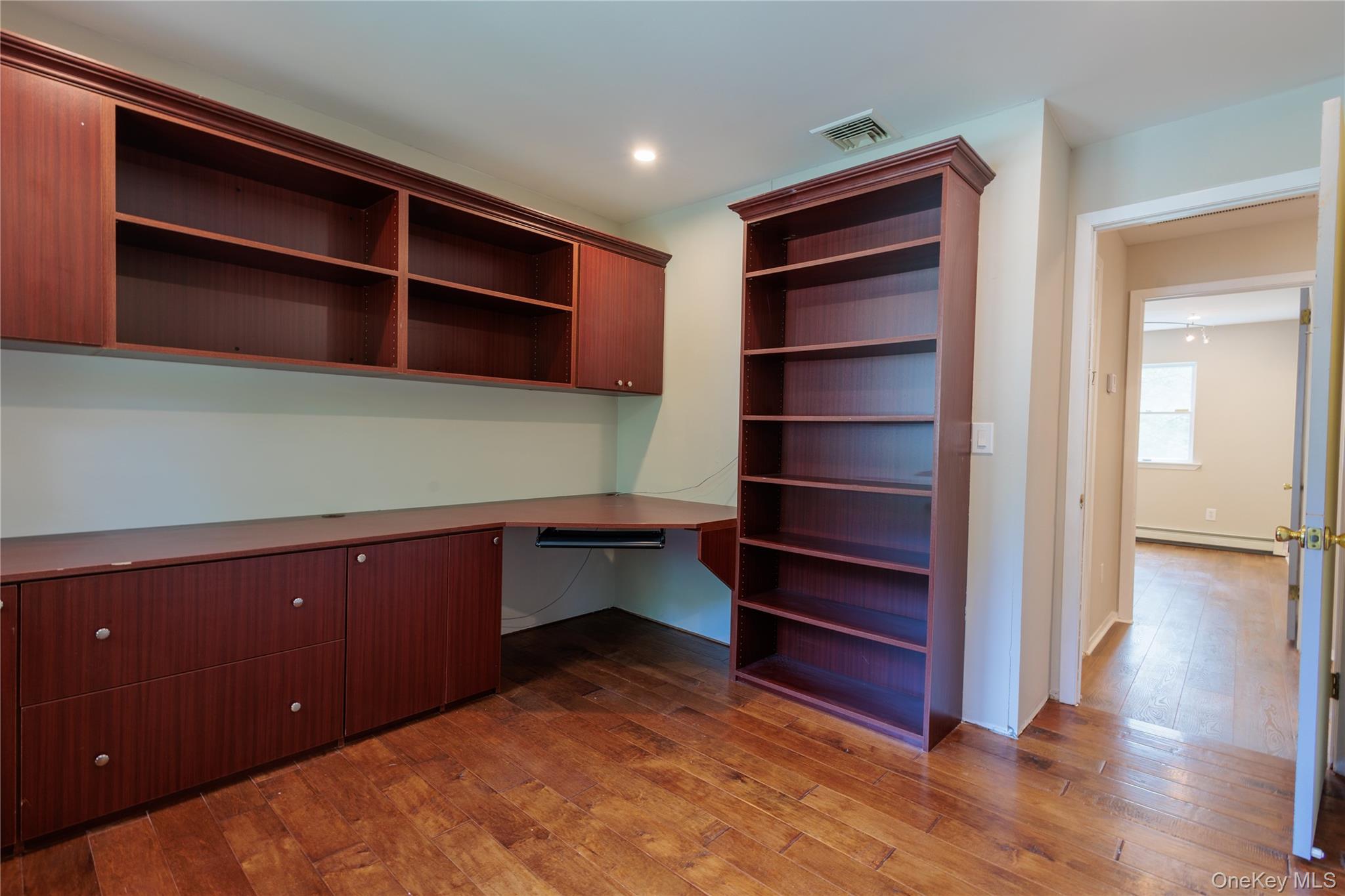 14 Hill Road St. James, NY 11780 - Photo 25 of 29 a room with cabinets and wooden floor