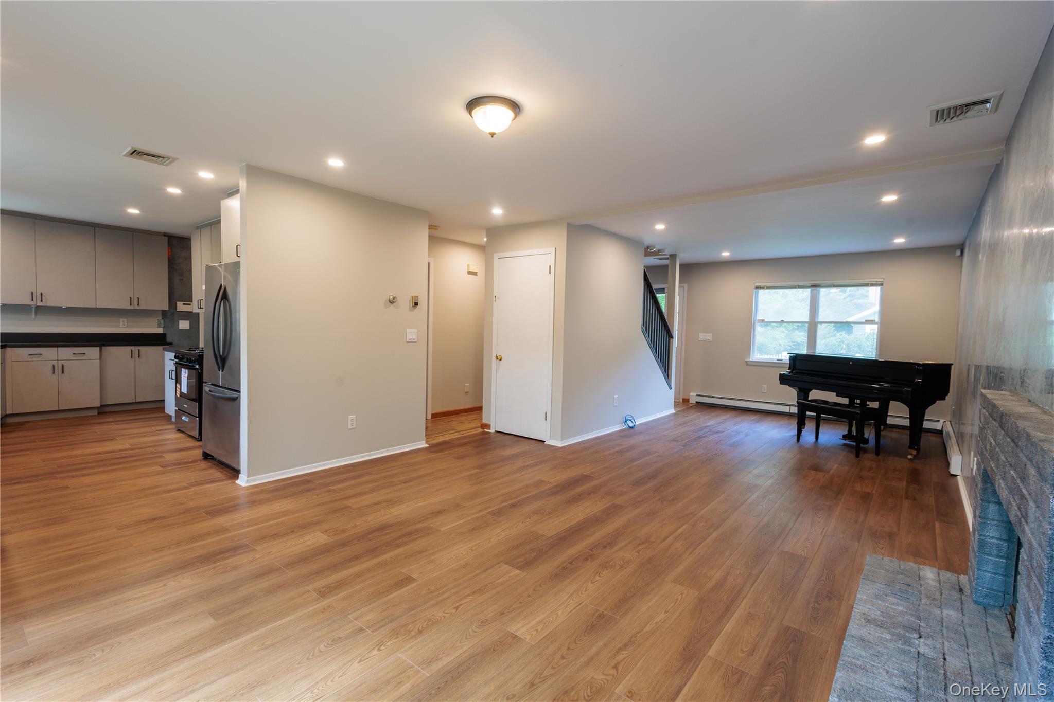 14 Hill Road St. James, NY 11780 - Photo 3 of 29 a view of livingroom with furniture and wooden floor