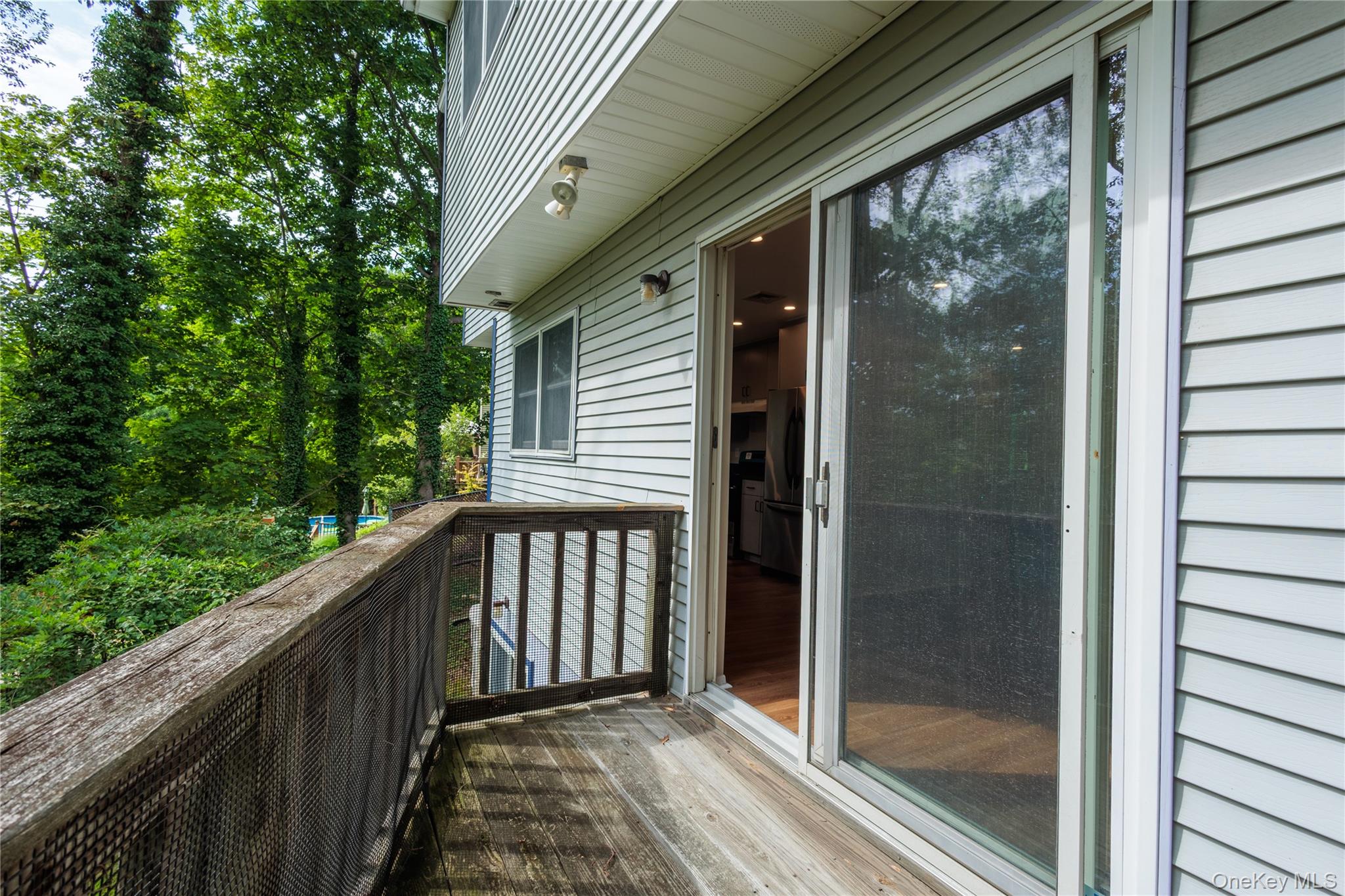 14 Hill Road St. James, NY 11780 - Photo 10 of 29 a view of a balcony with wooden floor
