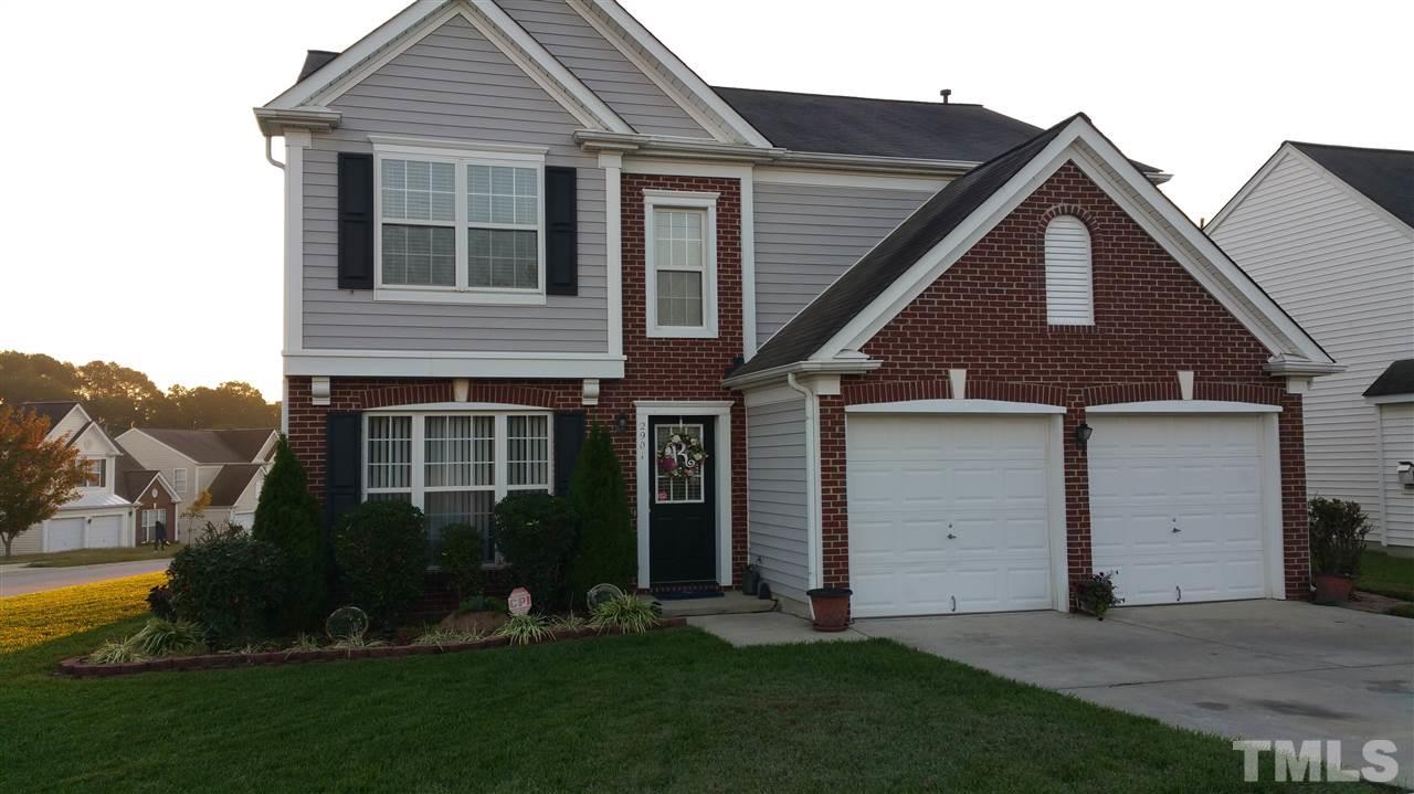 2901 Trassacks Drive Raleigh, NC 27610 - Photo 1 of 14 a front view of a house with a yard and garage