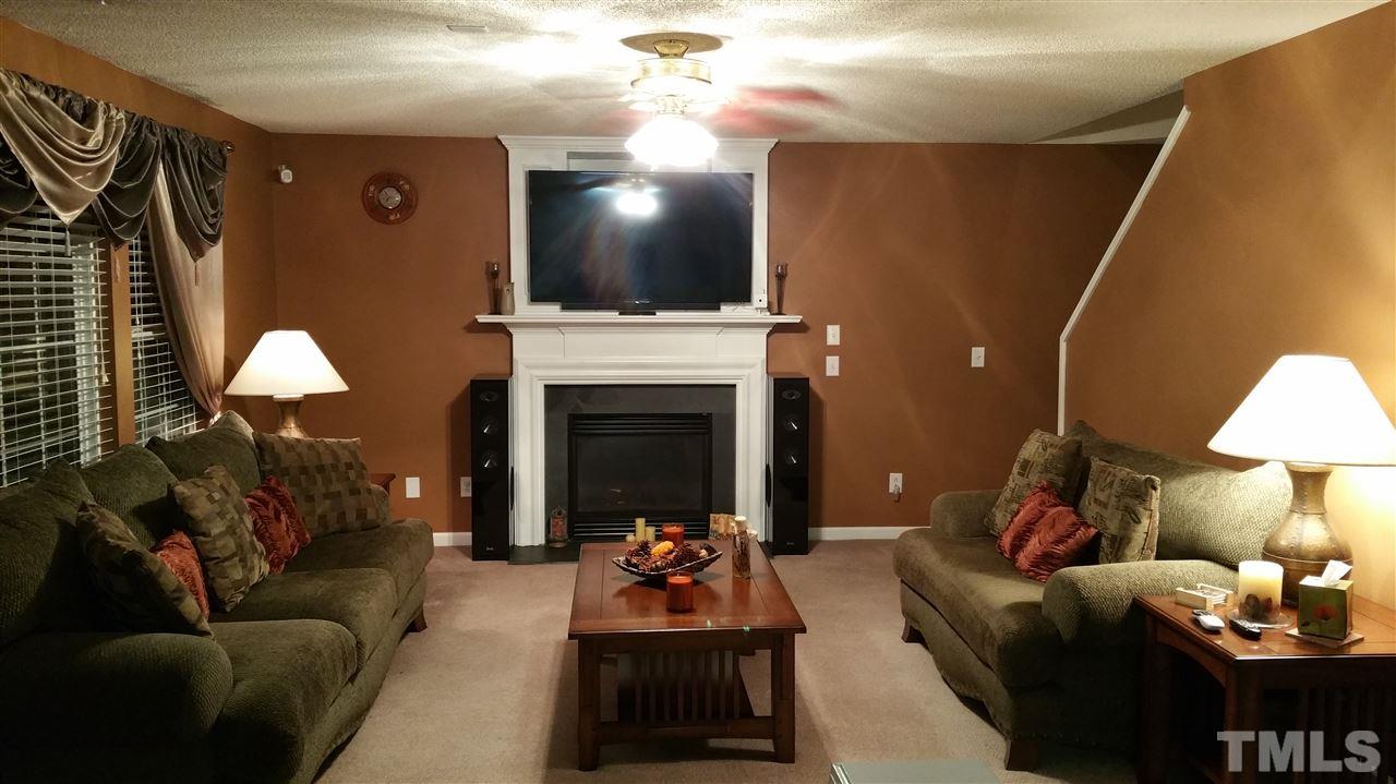 2901 Trassacks Drive Raleigh, NC 27610 - Photo 10 of 14 a living room with furniture and a fireplace