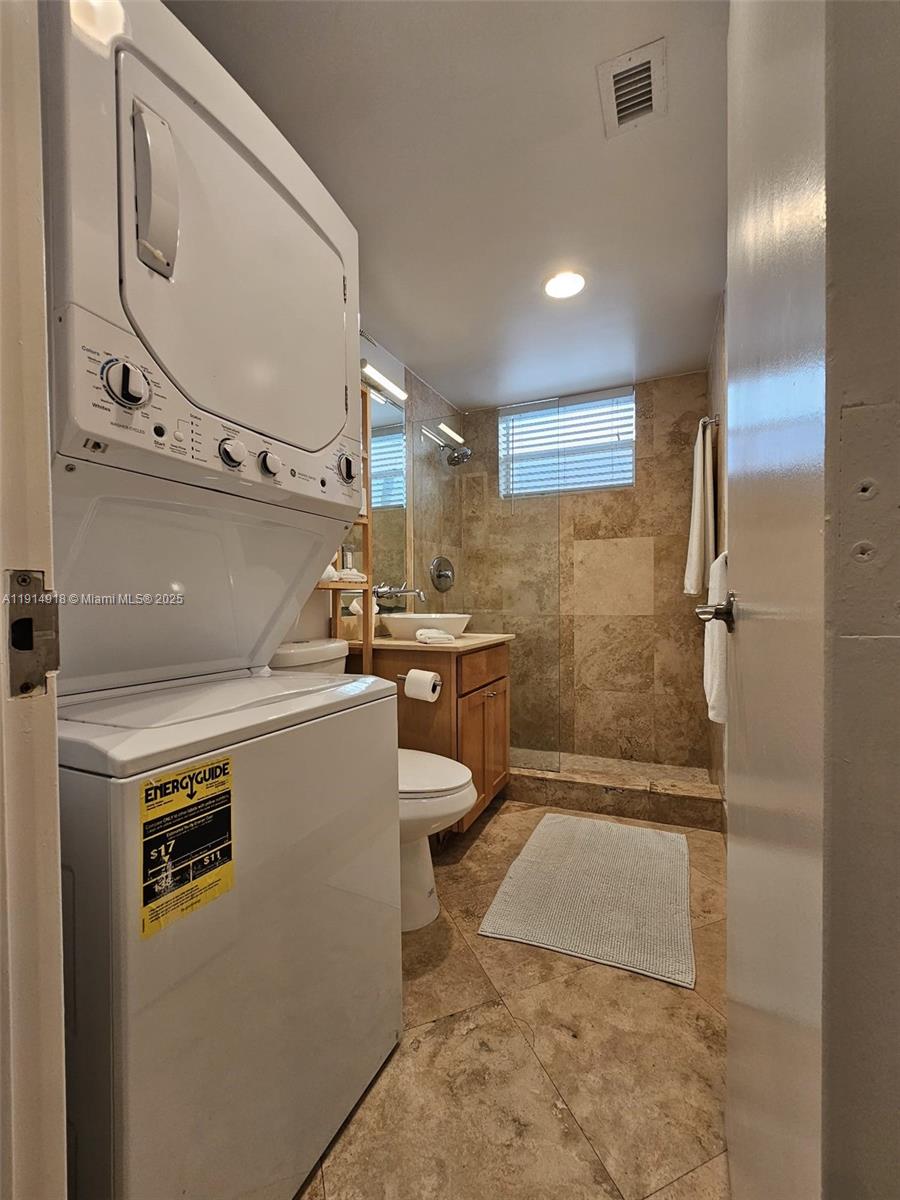 751 Collins Avenue, Unit 3 Miami Beach, FL 33139 - Photo 29 of 35 a bathroom with a sink a toilet and shower