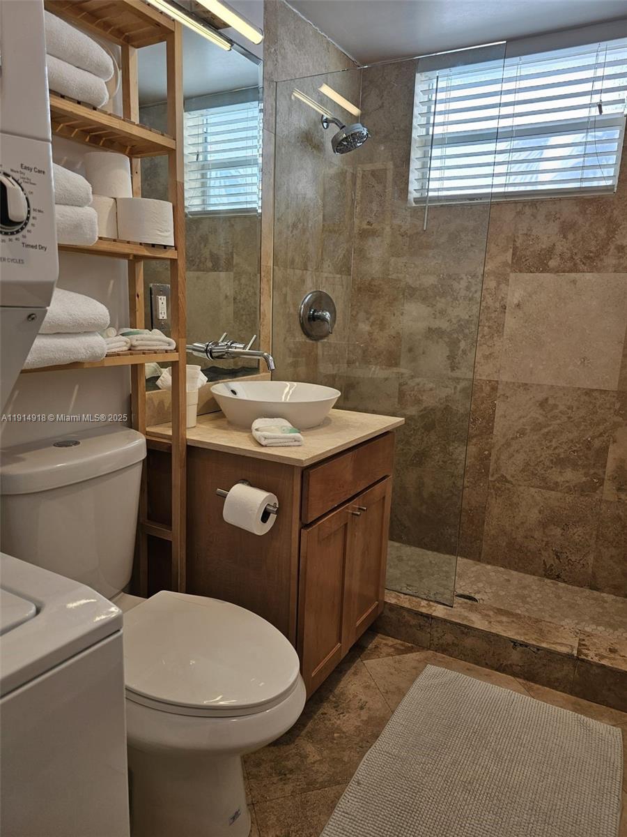 751 Collins Avenue, Unit 3 Miami Beach, FL 33139 - Photo 31 of 35 a bathroom with a sink toilet and shower