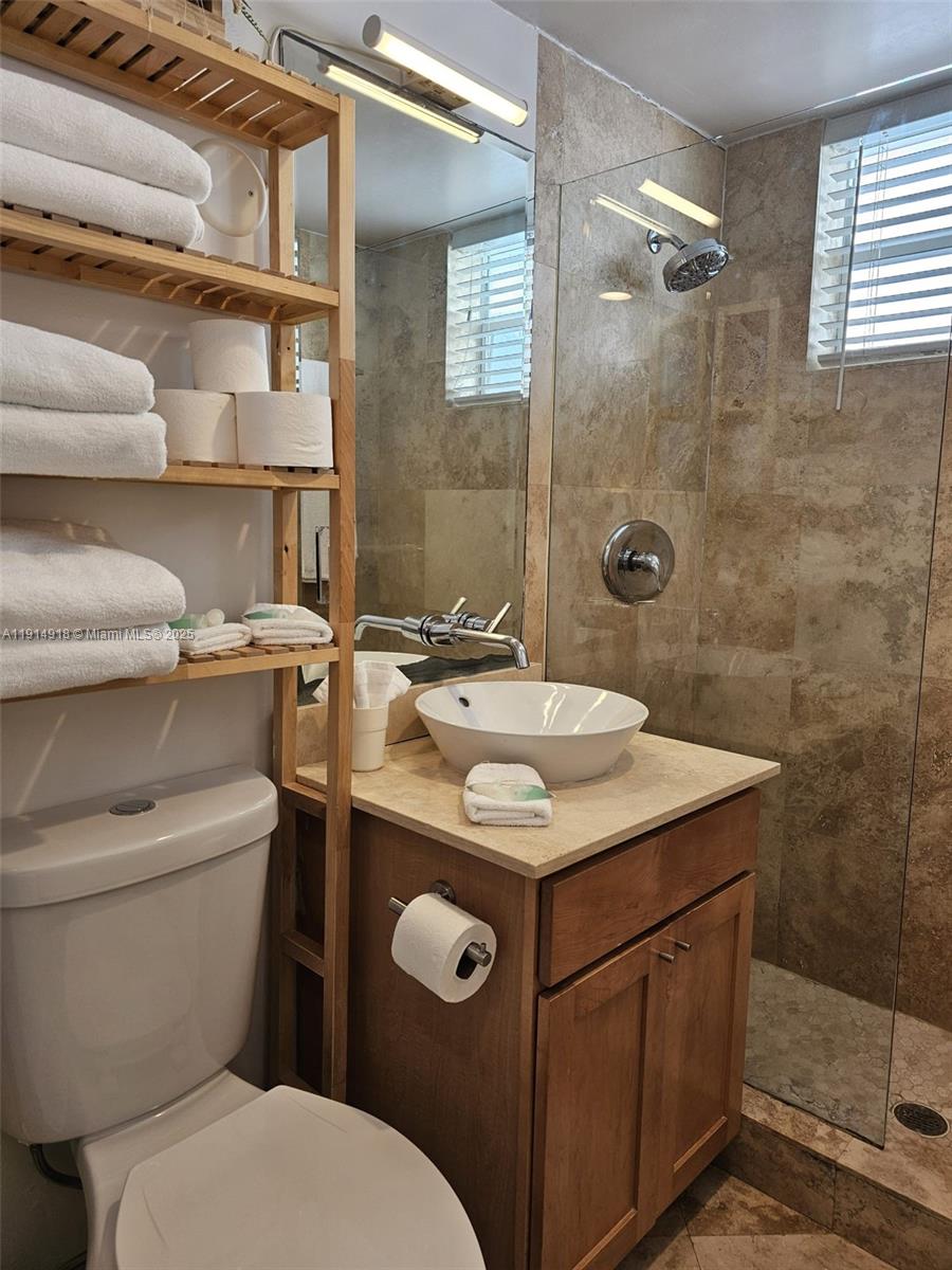 751 Collins Avenue, Unit 3 Miami Beach, FL 33139 - Photo 33 of 35 a bathroom with a sink toilet and shower