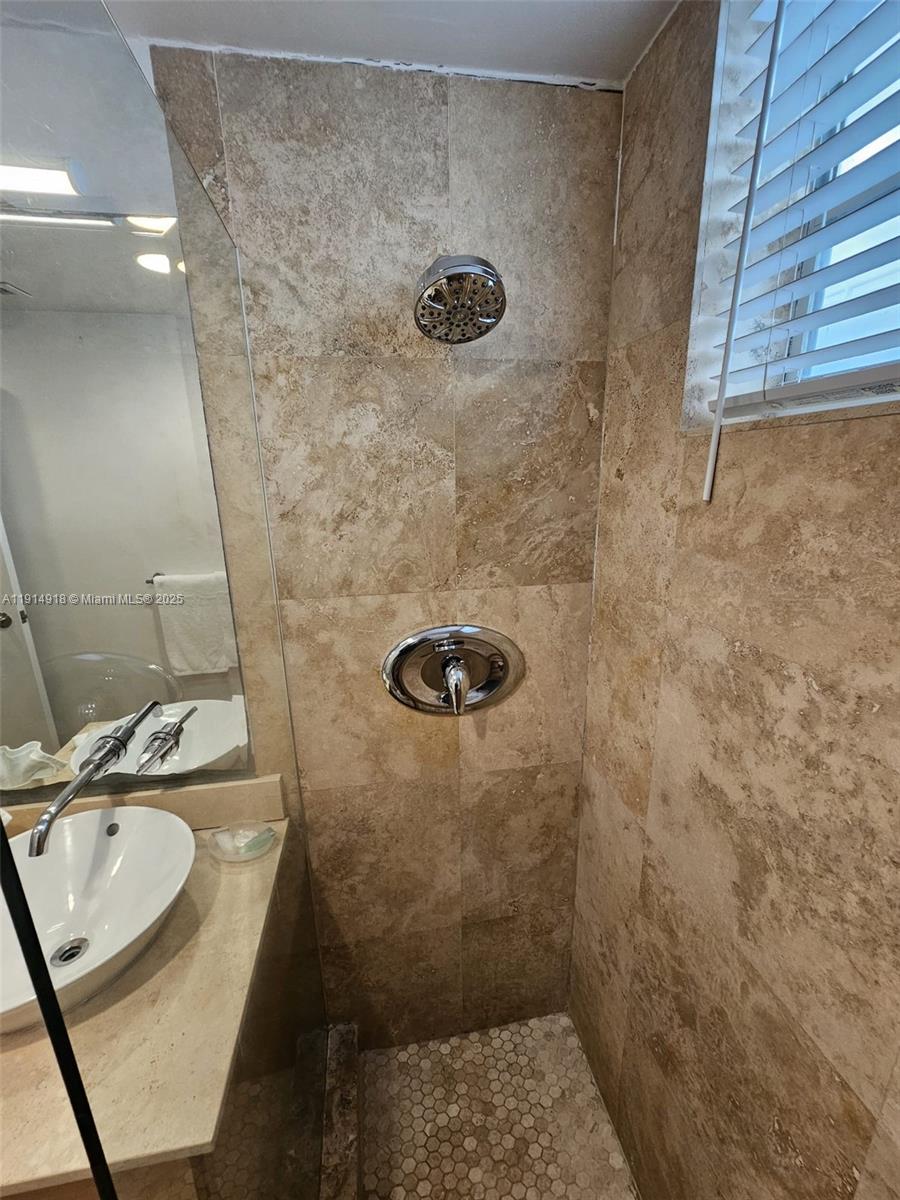 751 Collins Avenue, Unit 3 Miami Beach, FL 33139 - Photo 35 of 35 a bathroom with a sink toilet and shower