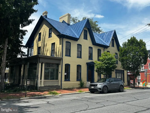 a view of multiple houses with a street