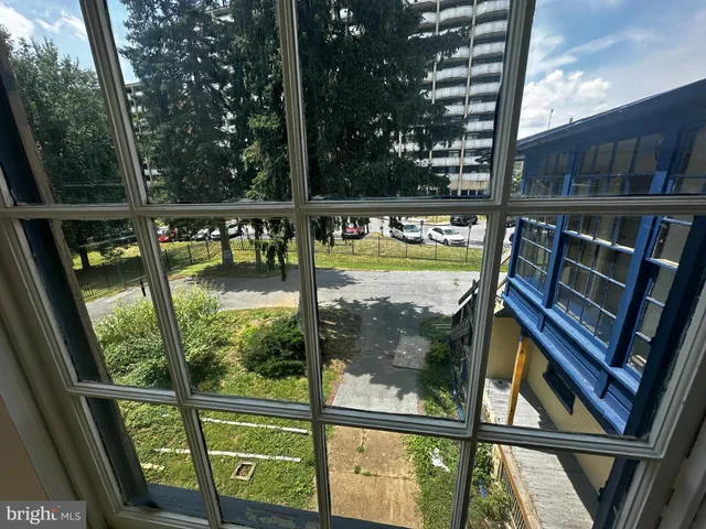a view of a two chairs in the balcony