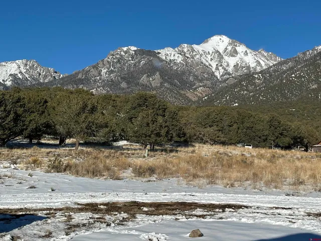 a view of a covered with snow on the road