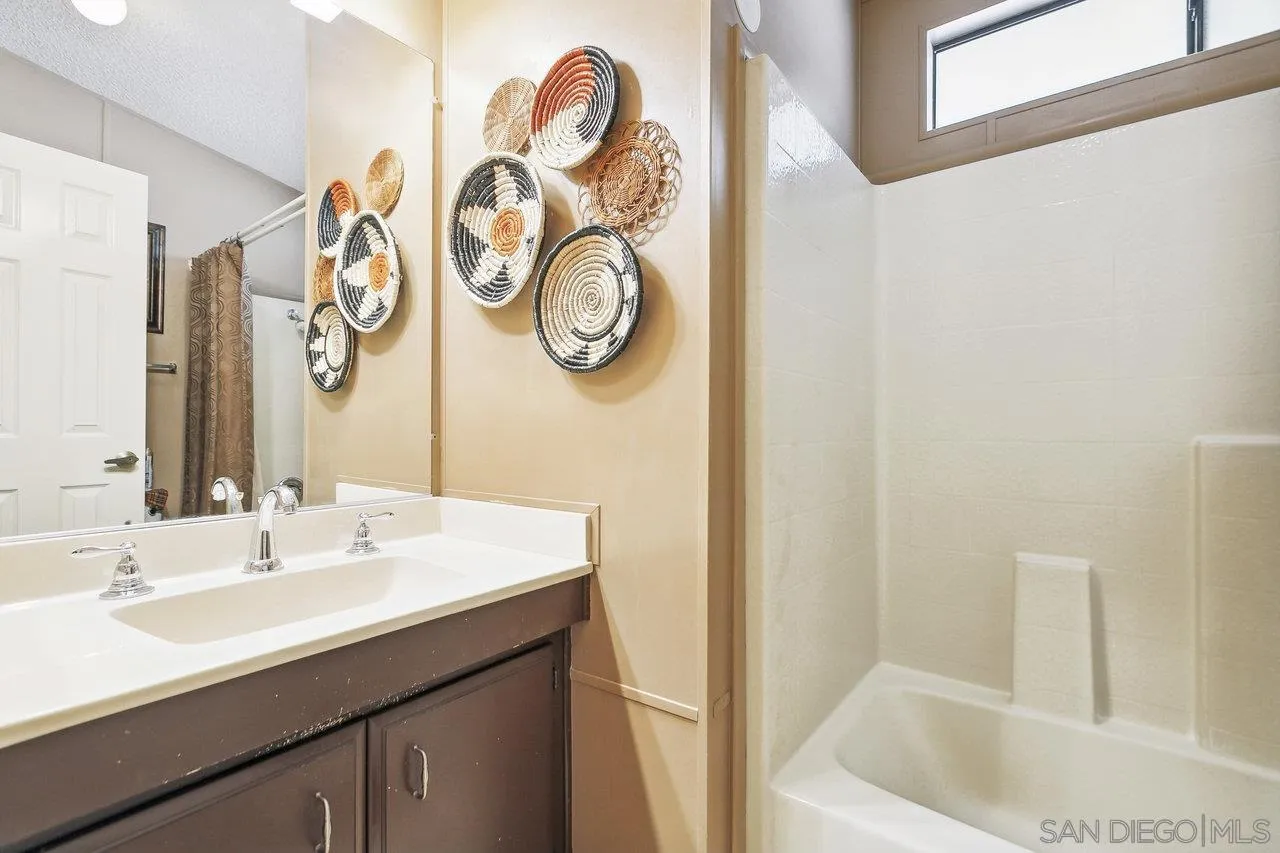 11949 Riverside Drive, Unit SPC 8 Lakeside, CA 92040 - Photo 14 of 29 a bathroom with a sink and a bathtub