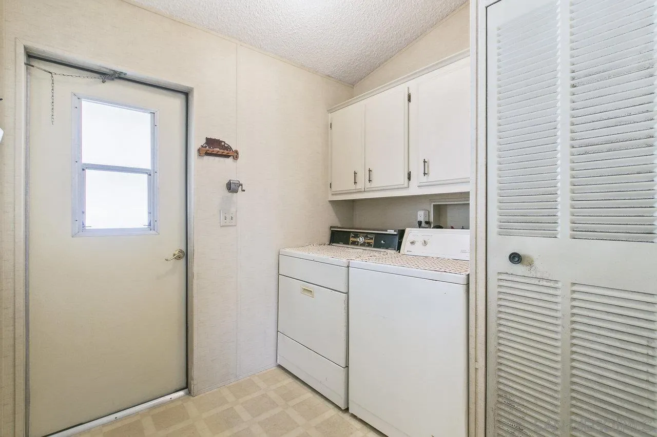 11949 Riverside Drive, Unit SPC 8 Lakeside, CA 92040 - Photo 18 of 29 a view of storage and utility room with washer and dryer