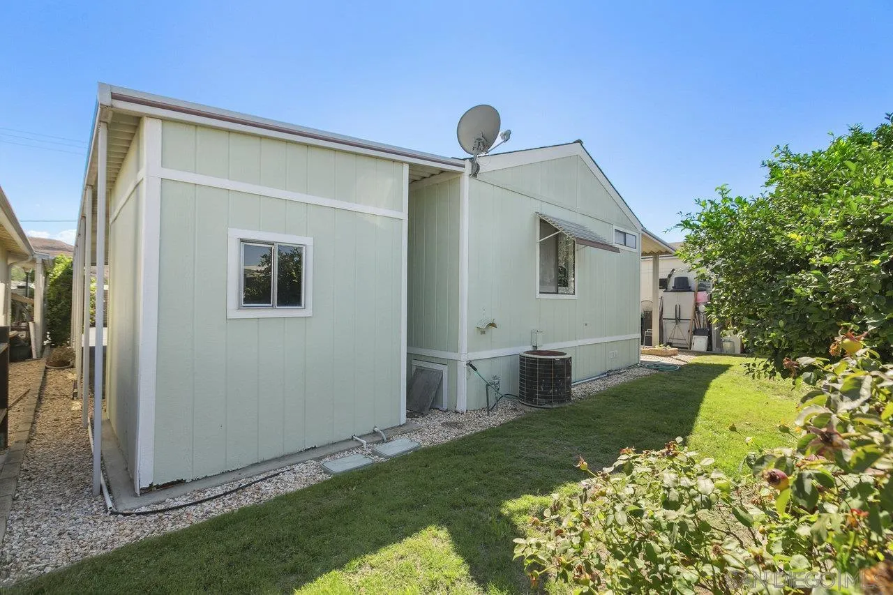 11949 Riverside Drive, Unit SPC 8 Lakeside, CA 92040 - Photo 22 of 29 a backyard of a house with table and chairs