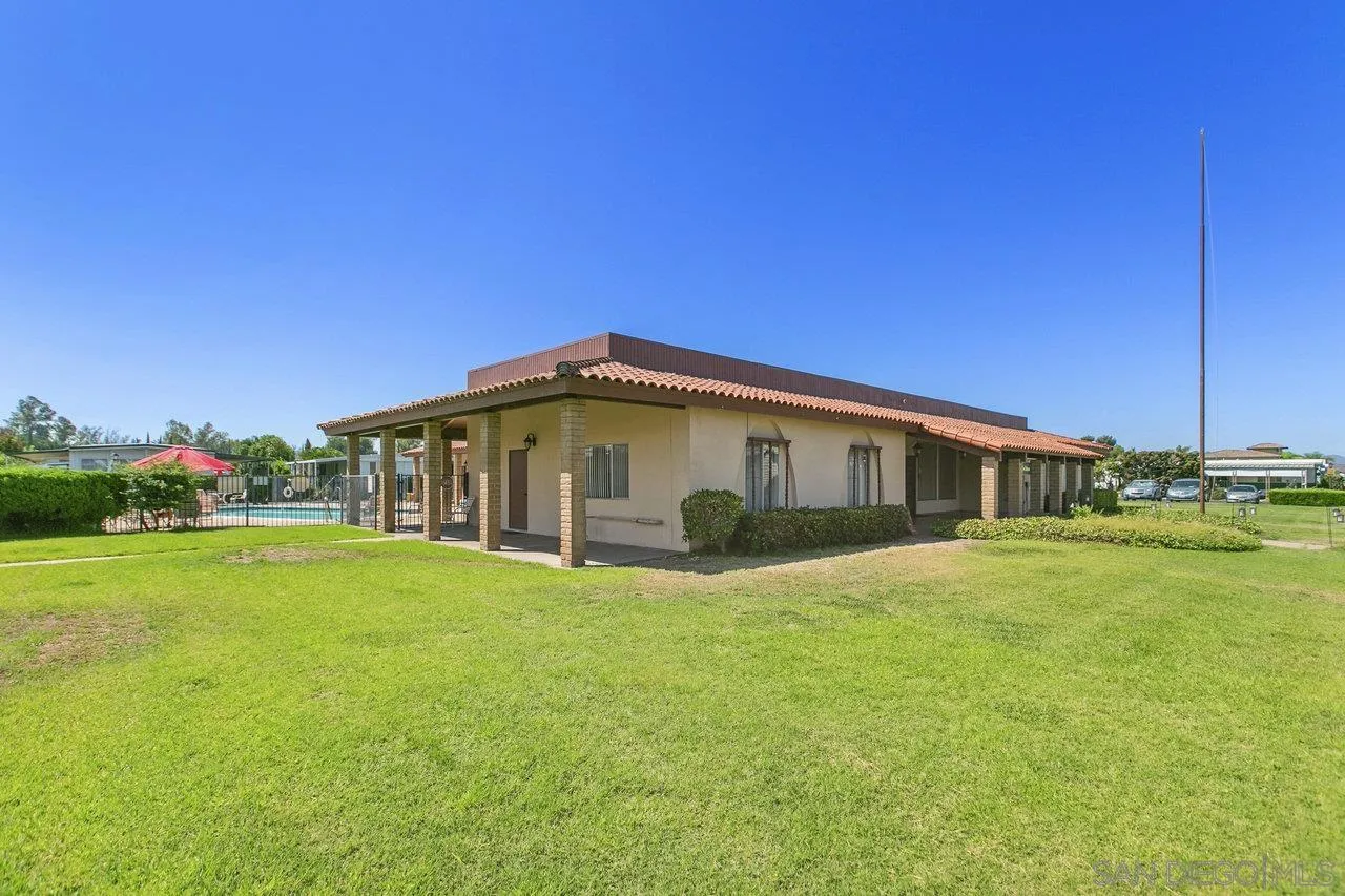 11949 Riverside Drive, Unit SPC 8 Lakeside, CA 92040 - Photo 24 of 29 a big house with swimming pool in front of it