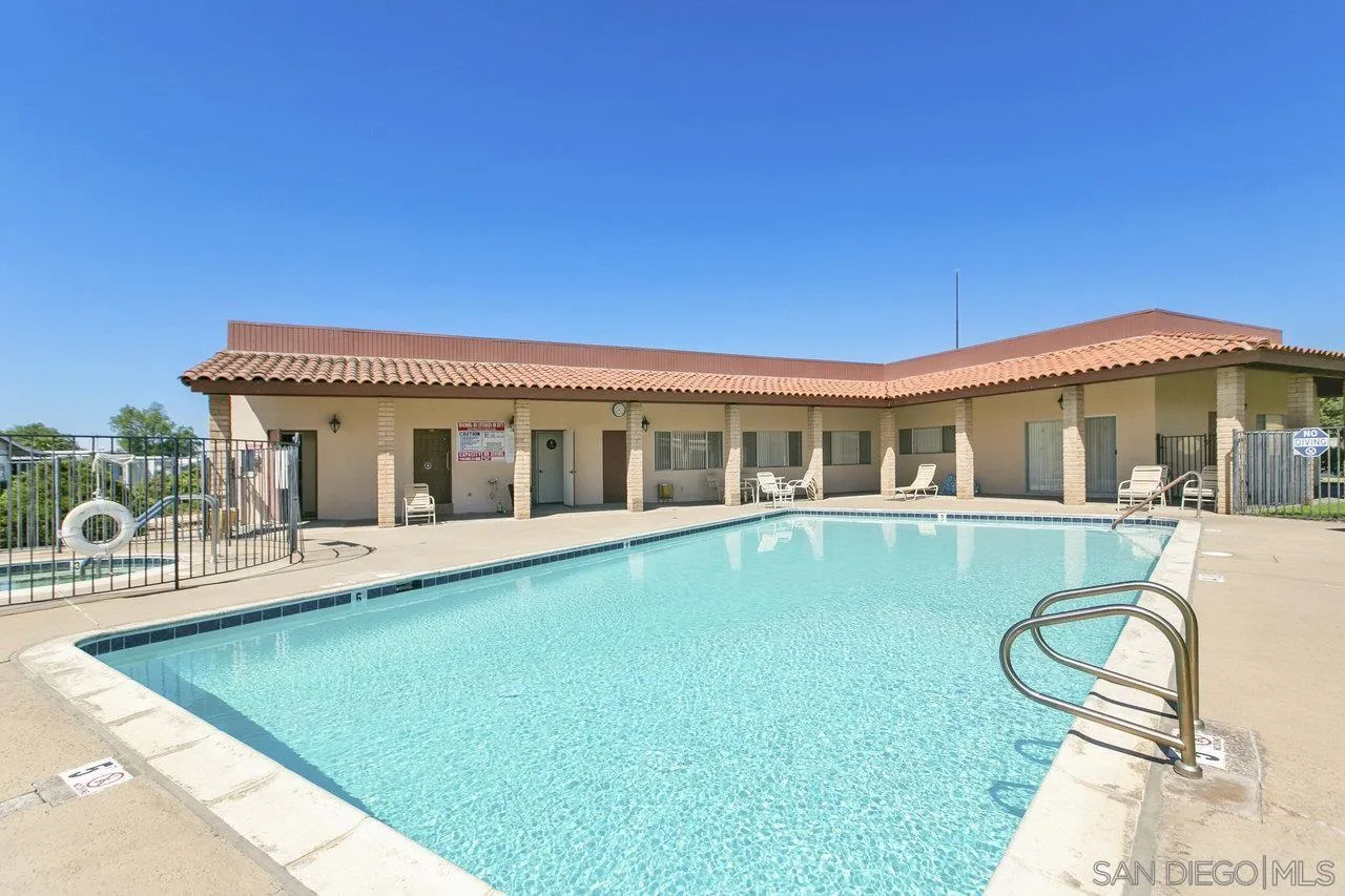 11949 Riverside Drive, Unit SPC 8 Lakeside, CA 92040 - Photo 26 of 29 a view of a house with swimming pool and sitting area