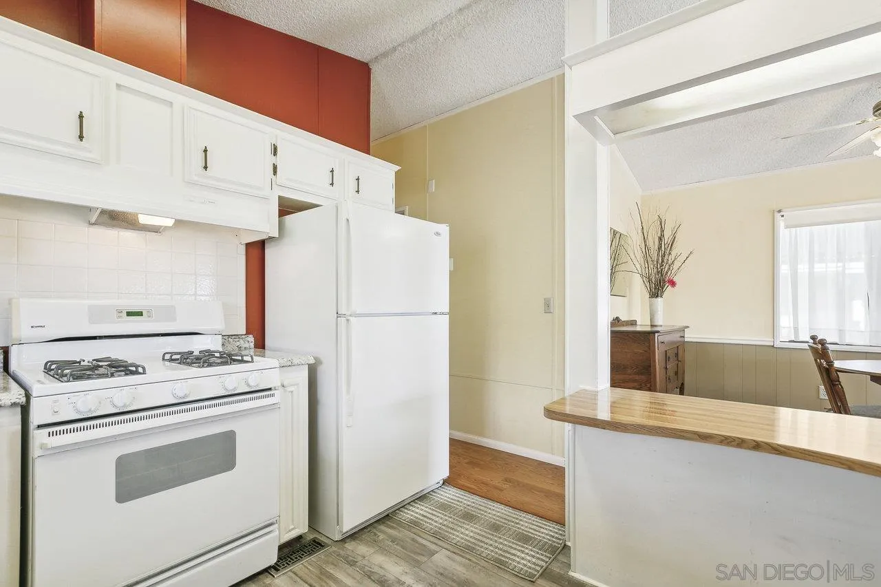 11949 Riverside Drive, Unit SPC 8 Lakeside, CA 92040 - Photo 6 of 29 a kitchen with a stove and a refrigerator