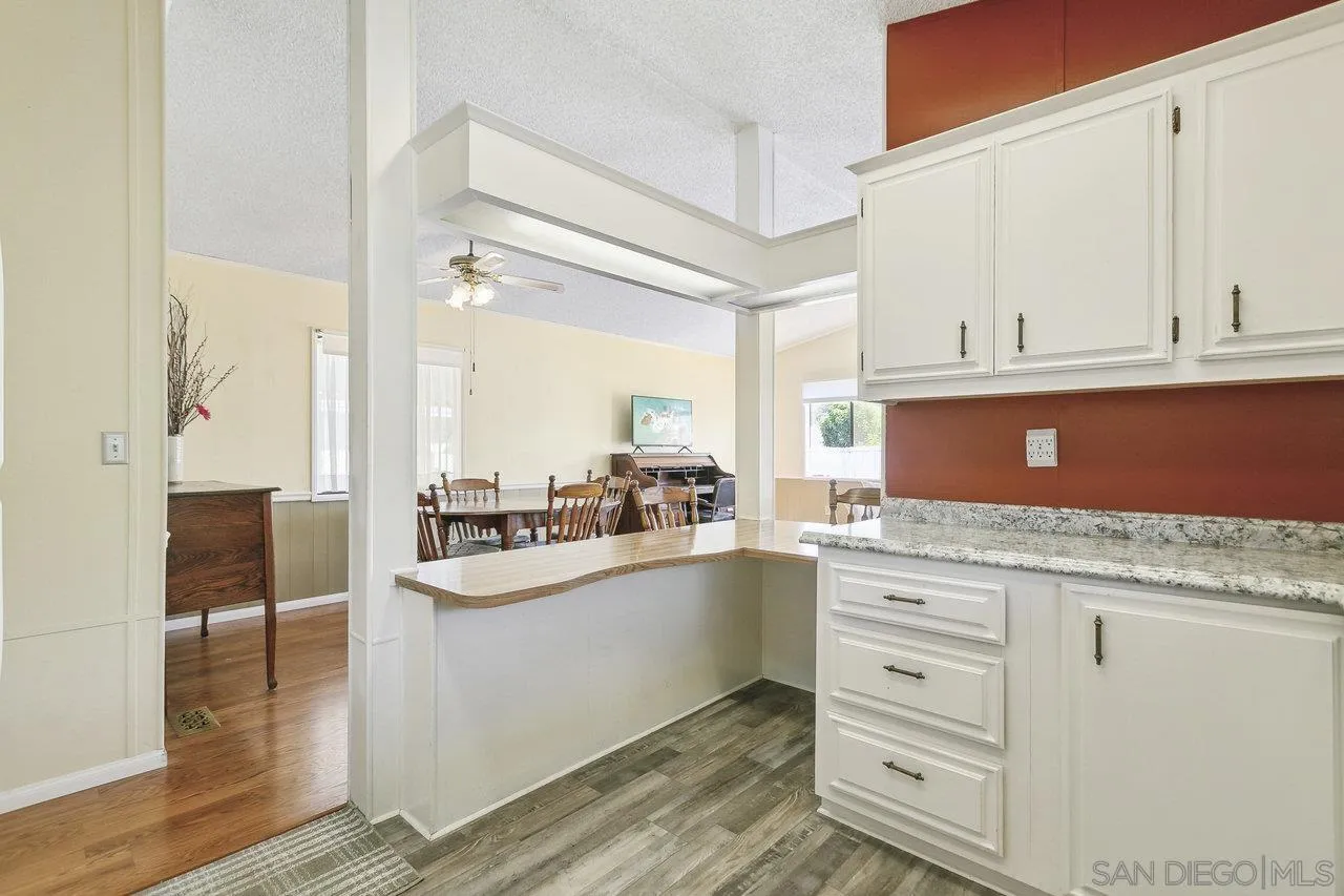 11949 Riverside Drive, Unit SPC 8 Lakeside, CA 92040 - Photo 7 of 29 a kitchen with granite countertop a sink and cabinets
