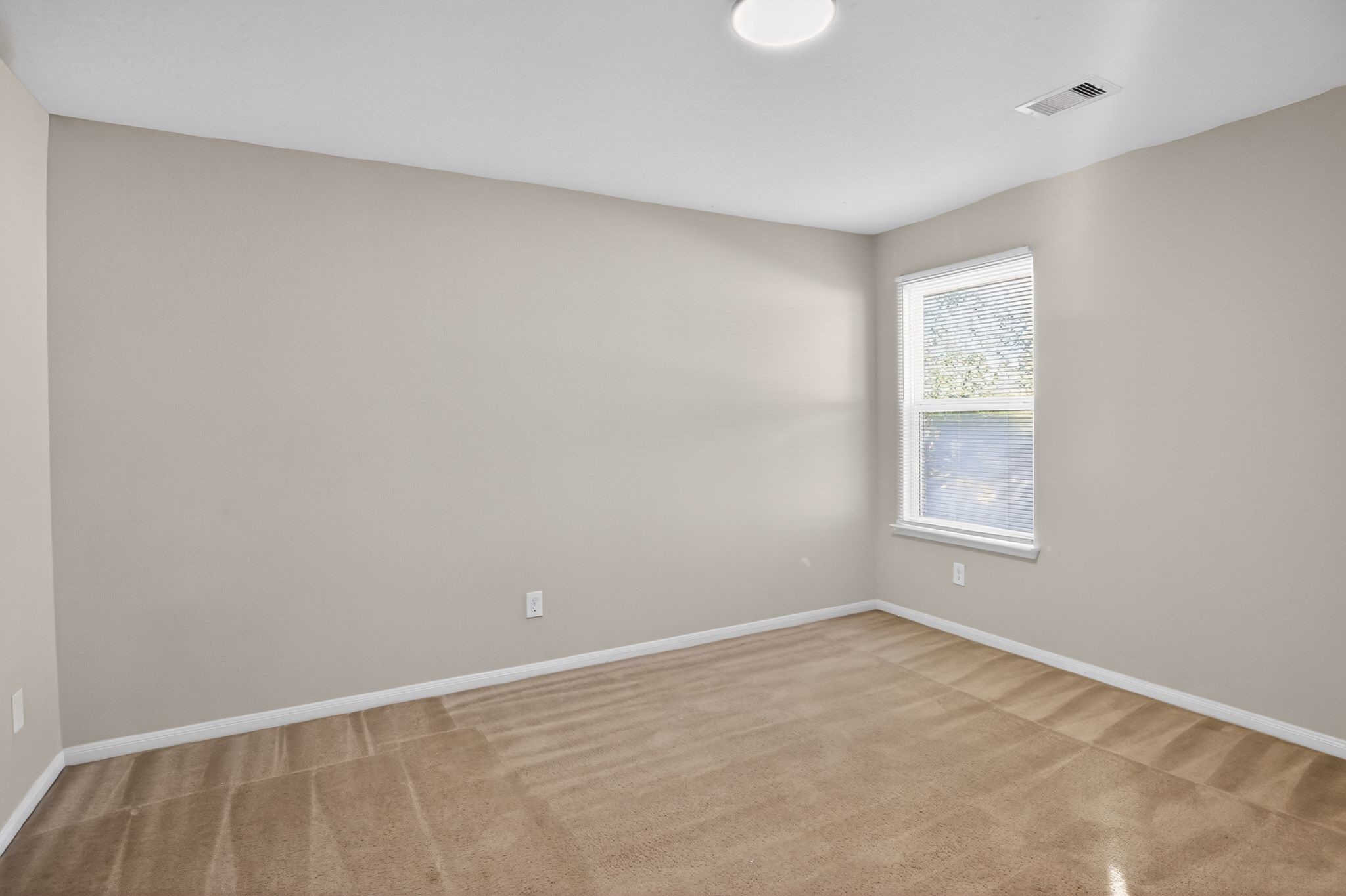 4938 Yearling Ridge Court Katy, TX 77449 - Photo 27 of 29 a view of an empty room with a window