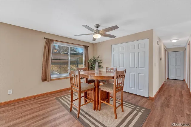 a view of a dining room with furniture window and wooden floor