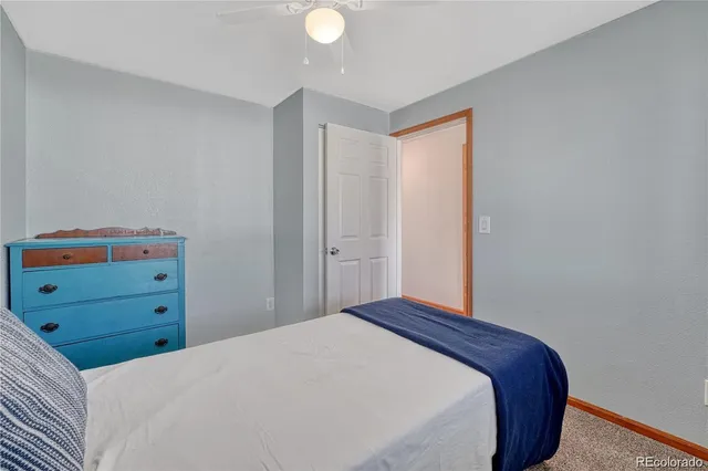 a bedroom with a bed and cabinets