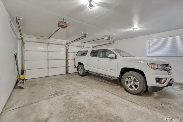 a view of a garage and car parked