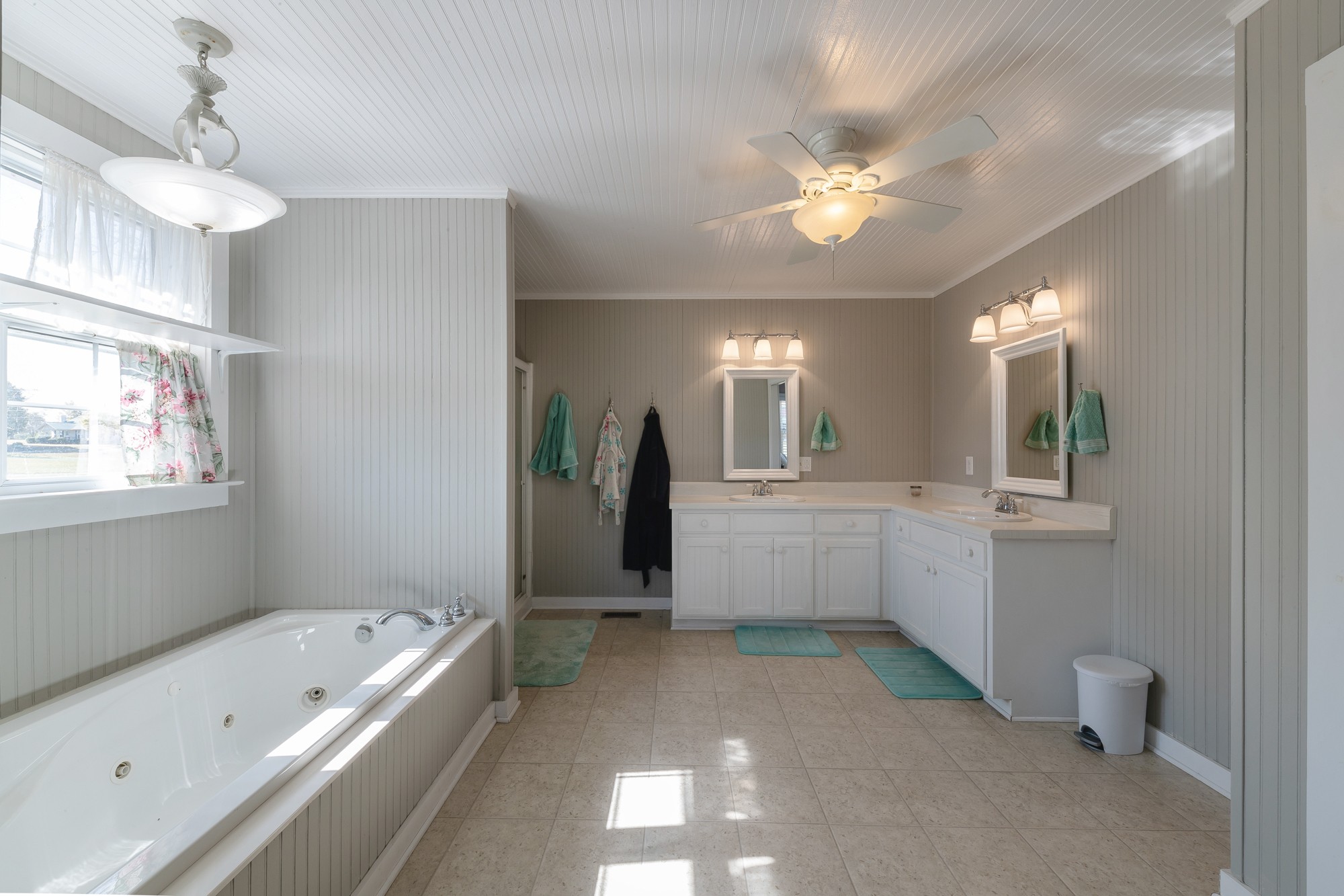 2341 Gideon Road Greenbrier, TN 37073 - Photo 19 of 30 a bathroom with a bathtub a shower a sink and a large mirror