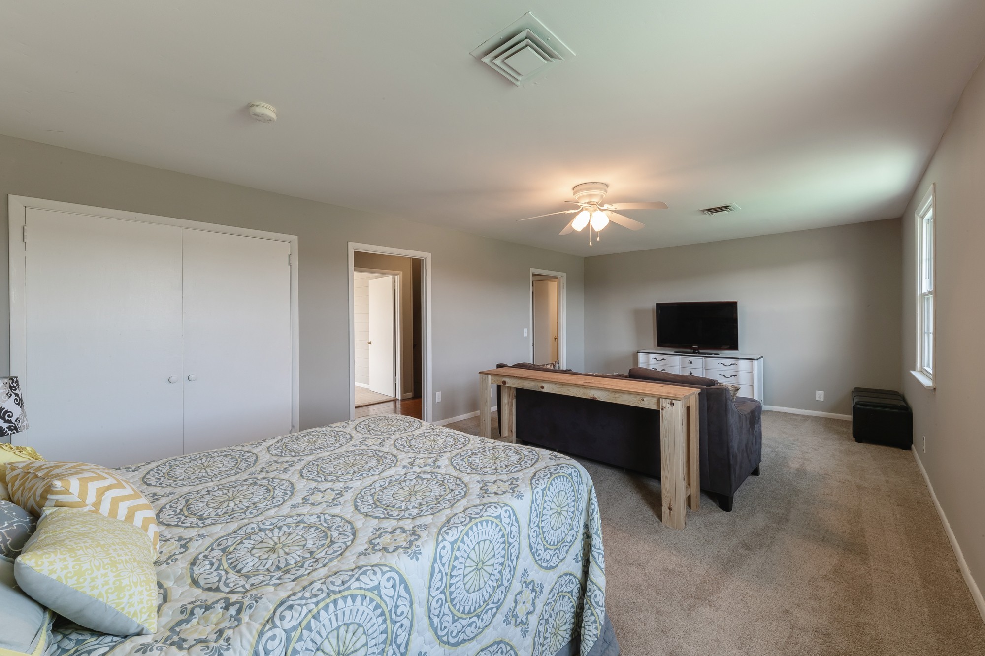 2341 Gideon Road Greenbrier, TN 37073 - Photo 21 of 30 a bedroom with a large bed and a flat screen tv