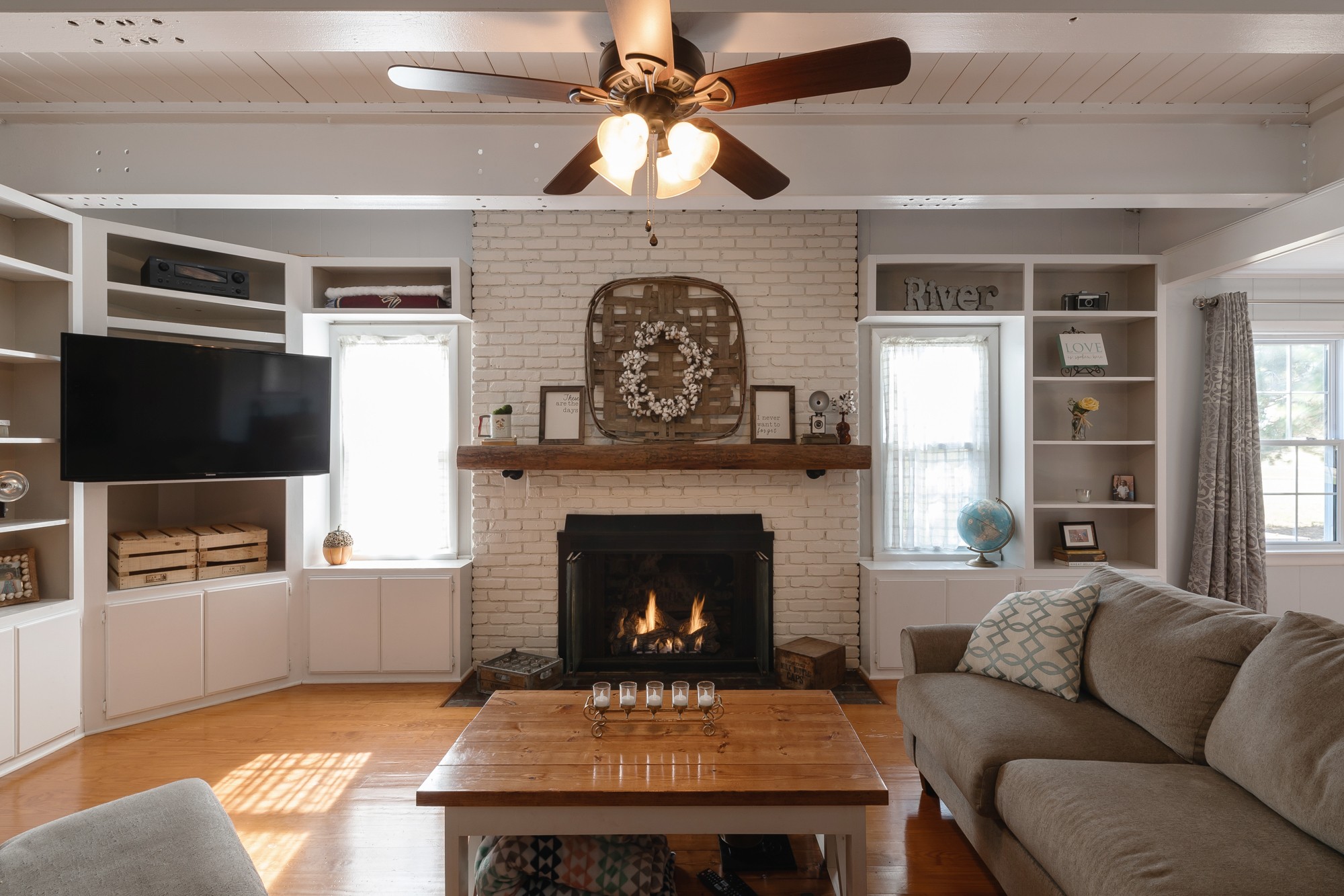 2341 Gideon Road Greenbrier, TN 37073 - Photo 10 of 30 a living room with furniture a fireplace and a flat screen tv