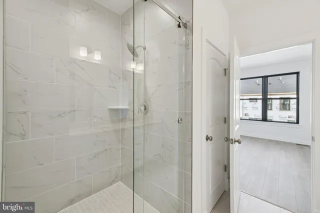 a bathroom with a bathtub and shower