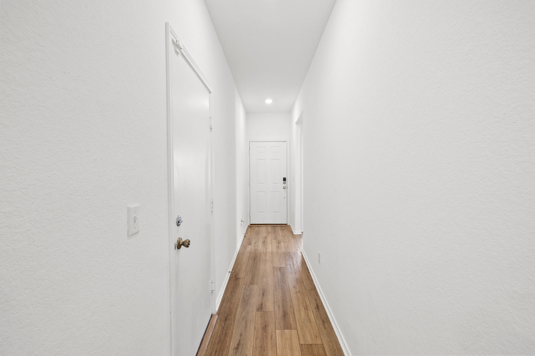 110 Madrid Kyle, TX 78640 - Photo 2 of 29 a view of a hallway with wooden floor