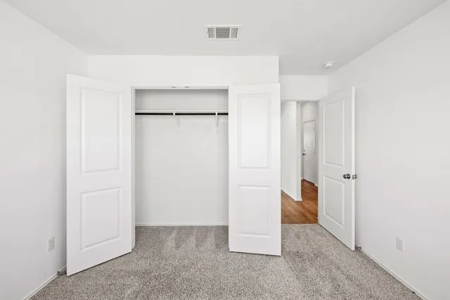 a bathroom with a sink toilet and mirror