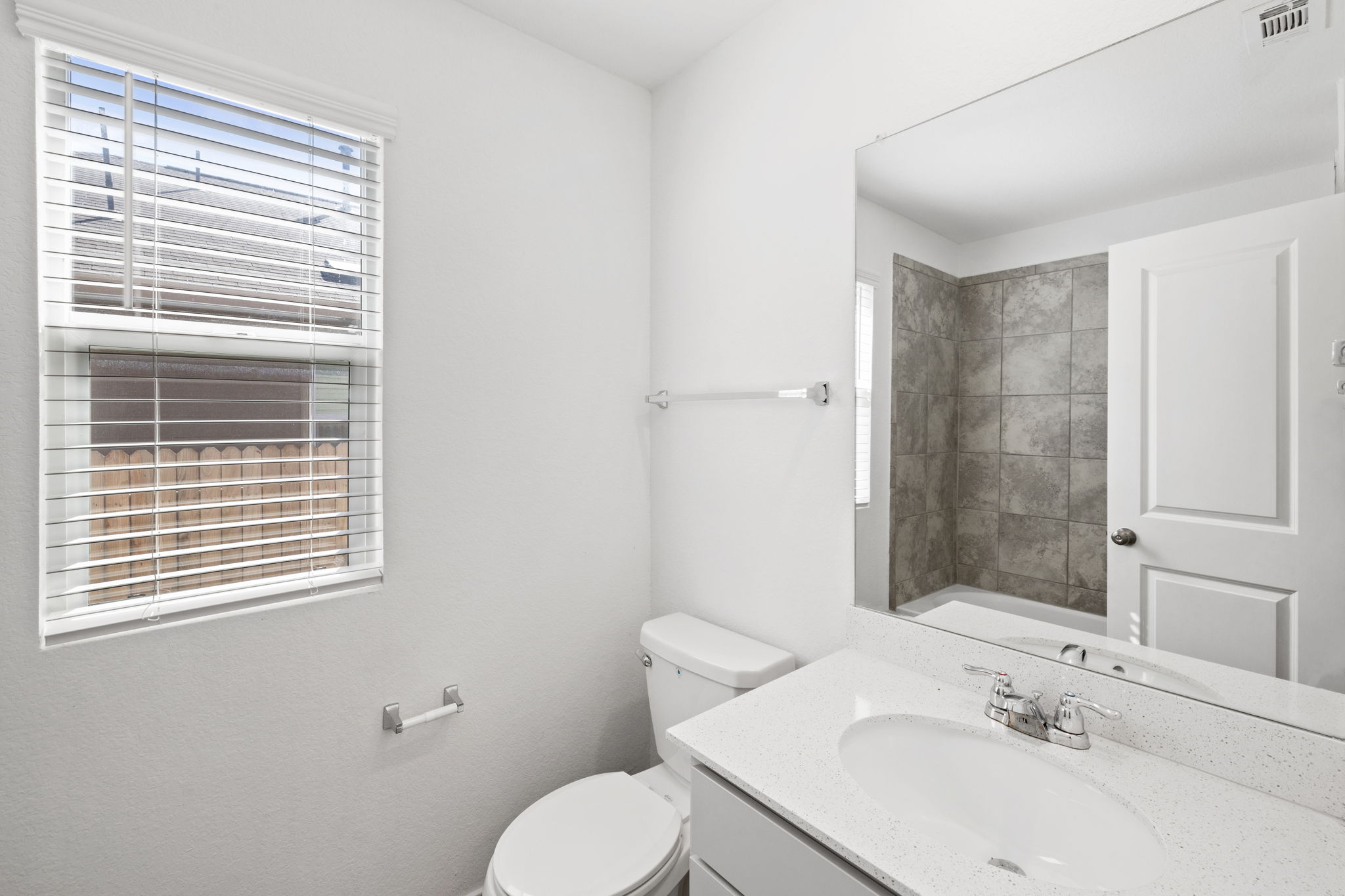110 Madrid Kyle, TX 78640 - Photo 23 of 29 a bathroom with a sink toilet and mirror