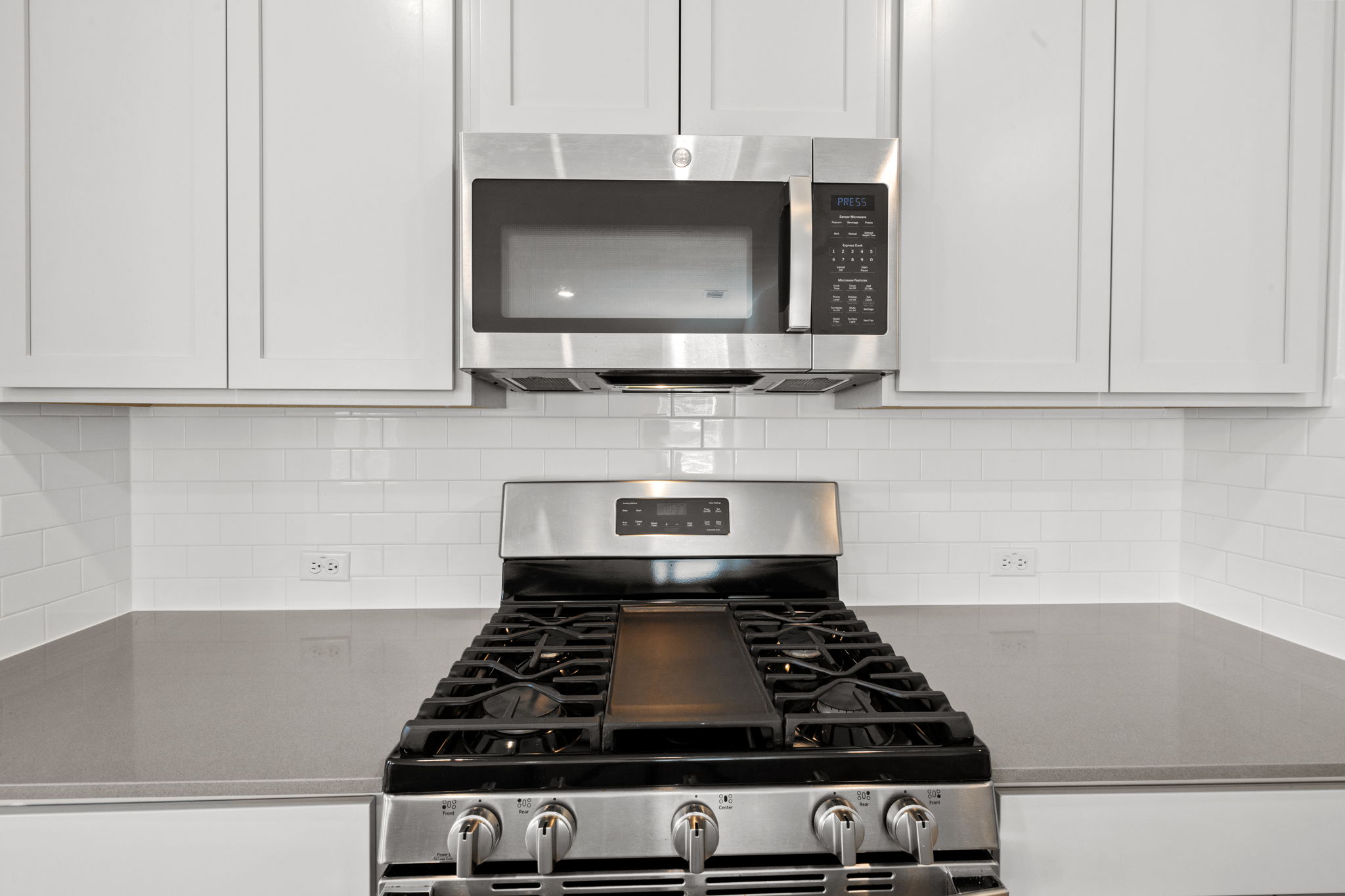 110 Madrid Kyle, TX 78640 - Photo 7 of 29 a stove top oven sitting inside of a kitchen