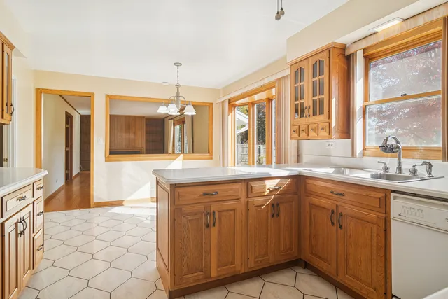 a spacious bathroom with a granite countertop sink and a large mirror