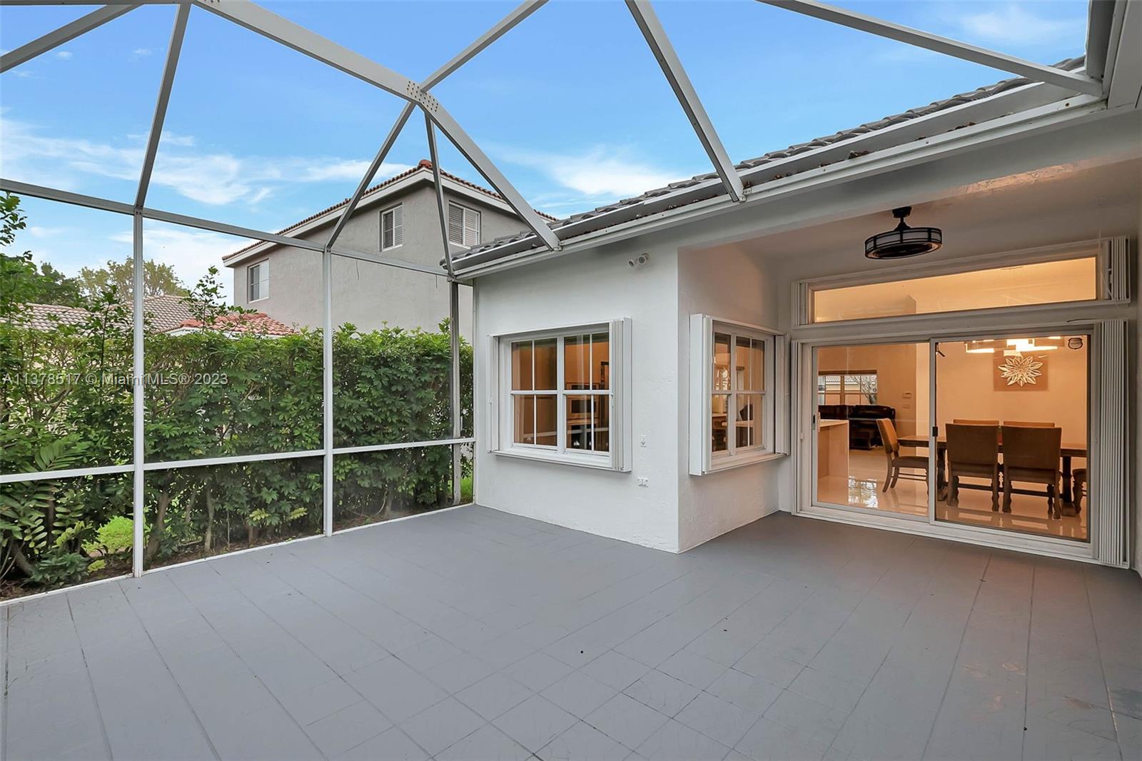 4115 Sabal Ridge Circle Weston, FL 33331 - Photo 15 of 31 a view of a house with a flat screen tv