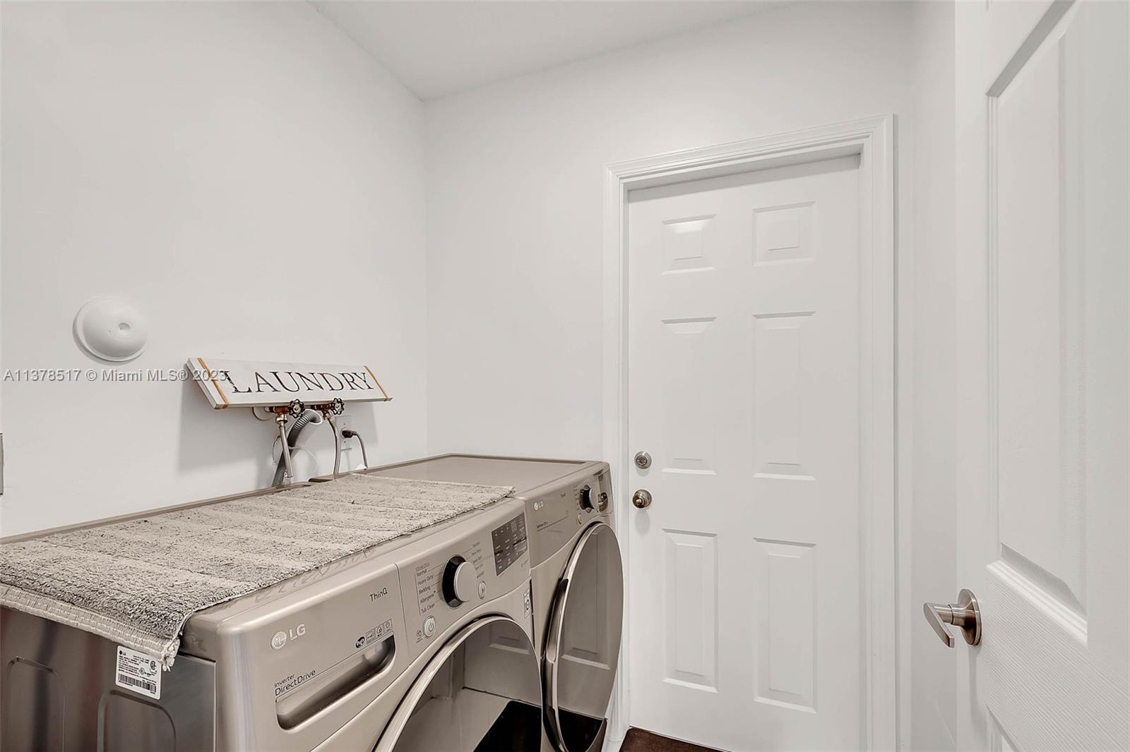 4115 Sabal Ridge Circle Weston, FL 33331 - Photo 20 of 31 a utility room with dryer and washer