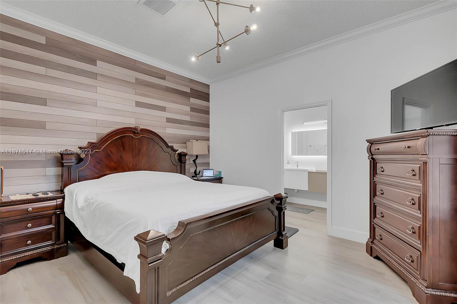 4115 Sabal Ridge Circle Weston, FL 33331 - Photo 22 of 31 a bedroom with a bed and dresser