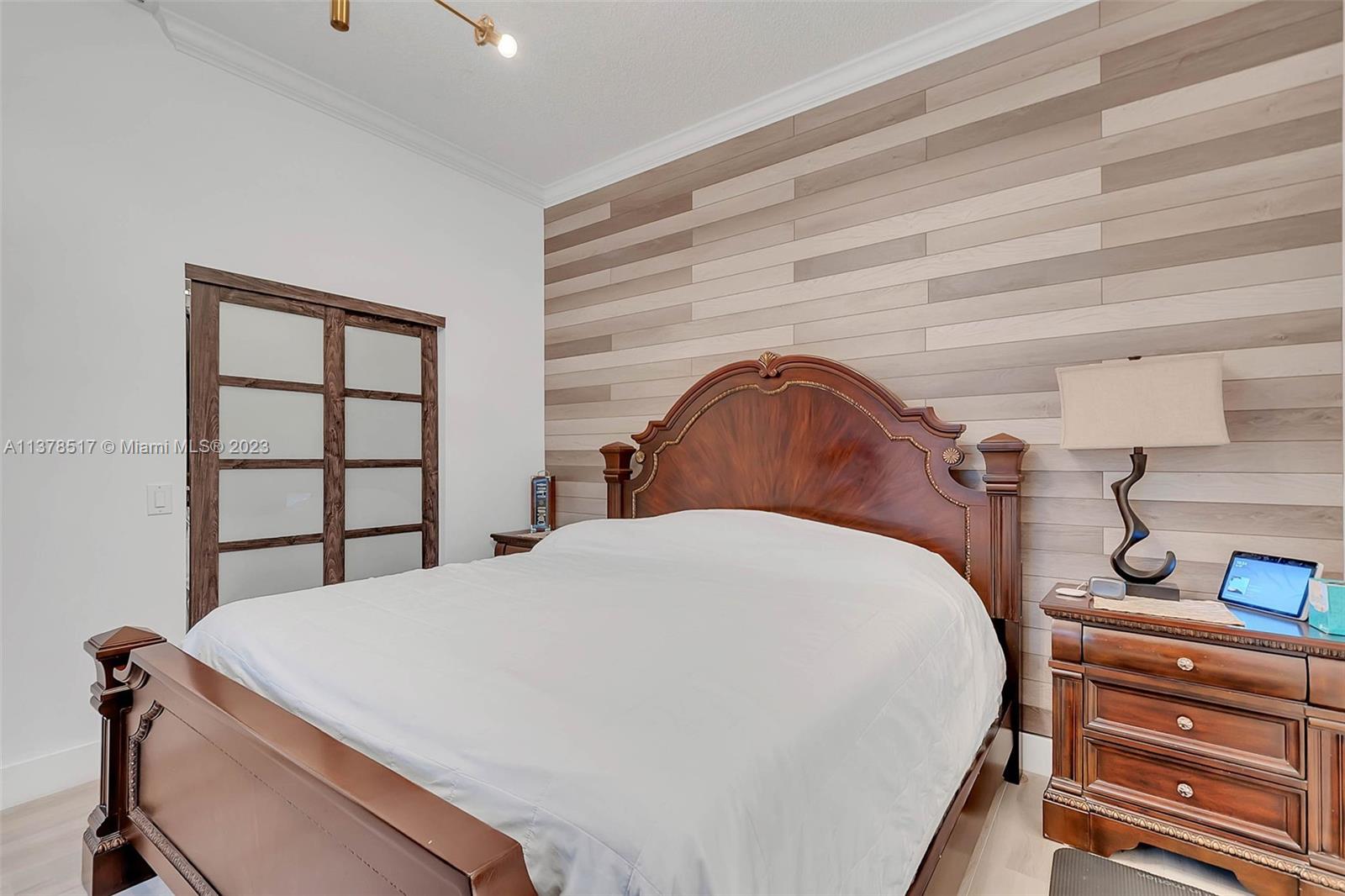 4115 Sabal Ridge Circle Weston, FL 33331 - Photo 24 of 31 a bedroom with a bed and a window