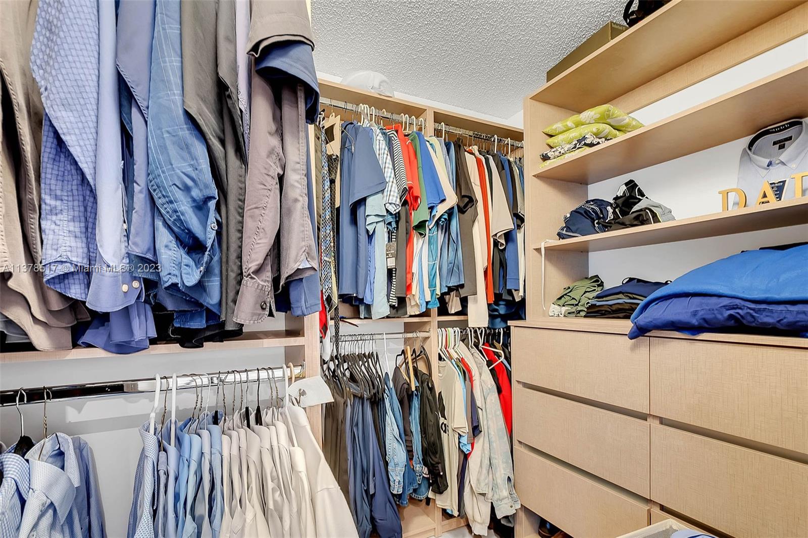4115 Sabal Ridge Circle Weston, FL 33331 - Photo 25 of 31 a view of walk in closet with clothes and shoes