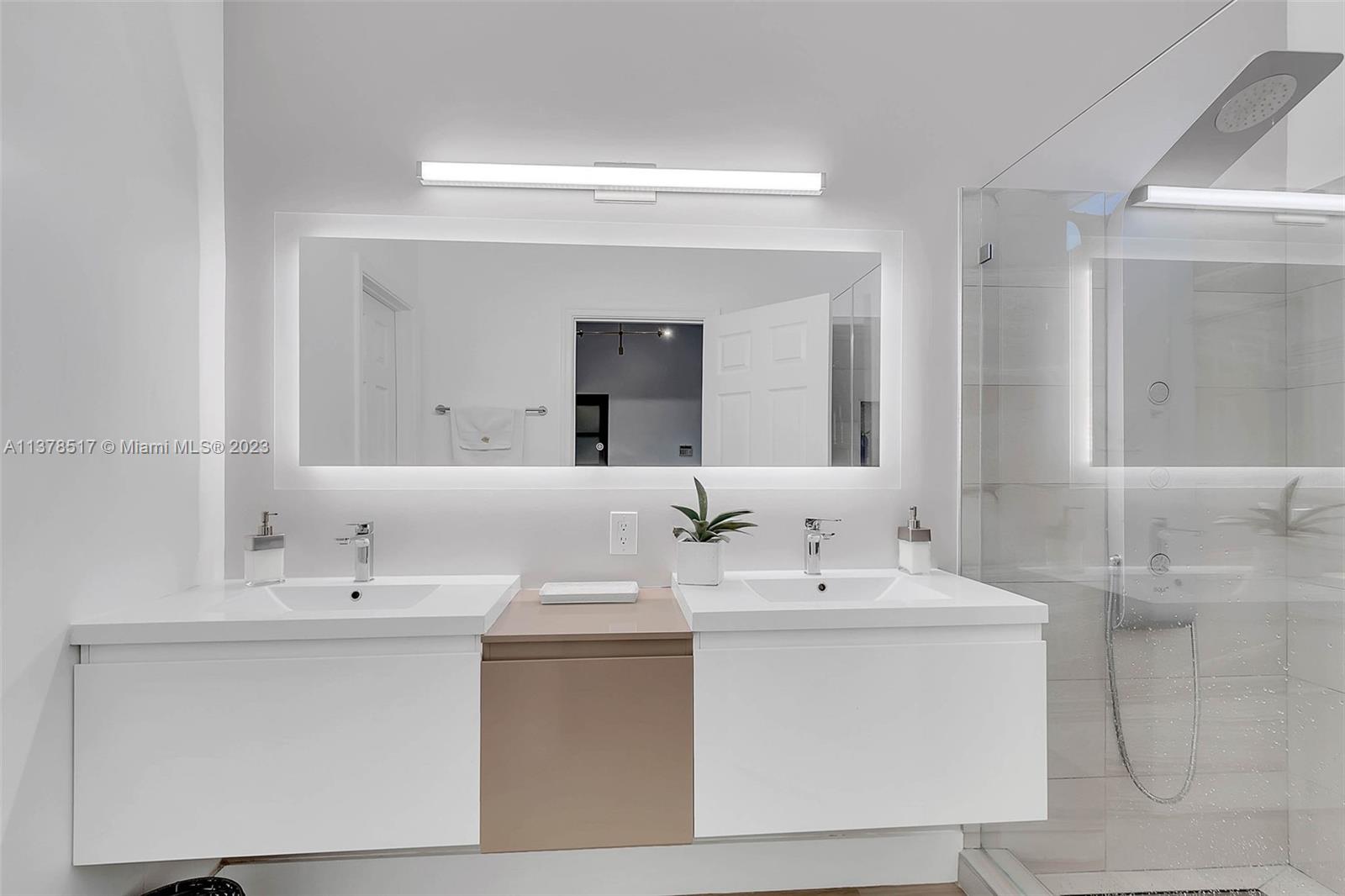 4115 Sabal Ridge Circle Weston, FL 33331 - Photo 26 of 31 a bathroom with a sink vanity and a mirror