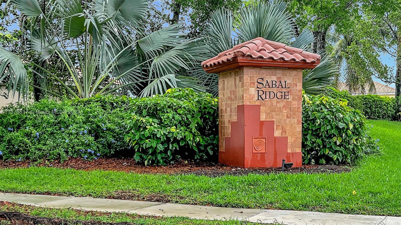 4115 Sabal Ridge Circle Weston, FL 33331 - Photo 30 of 31 a front view of a house with garden
