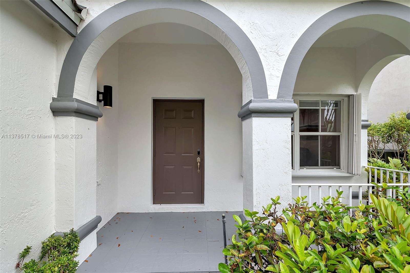 4115 Sabal Ridge Circle Weston, FL 33331 - Photo 31 of 31 a front view of a house with garden