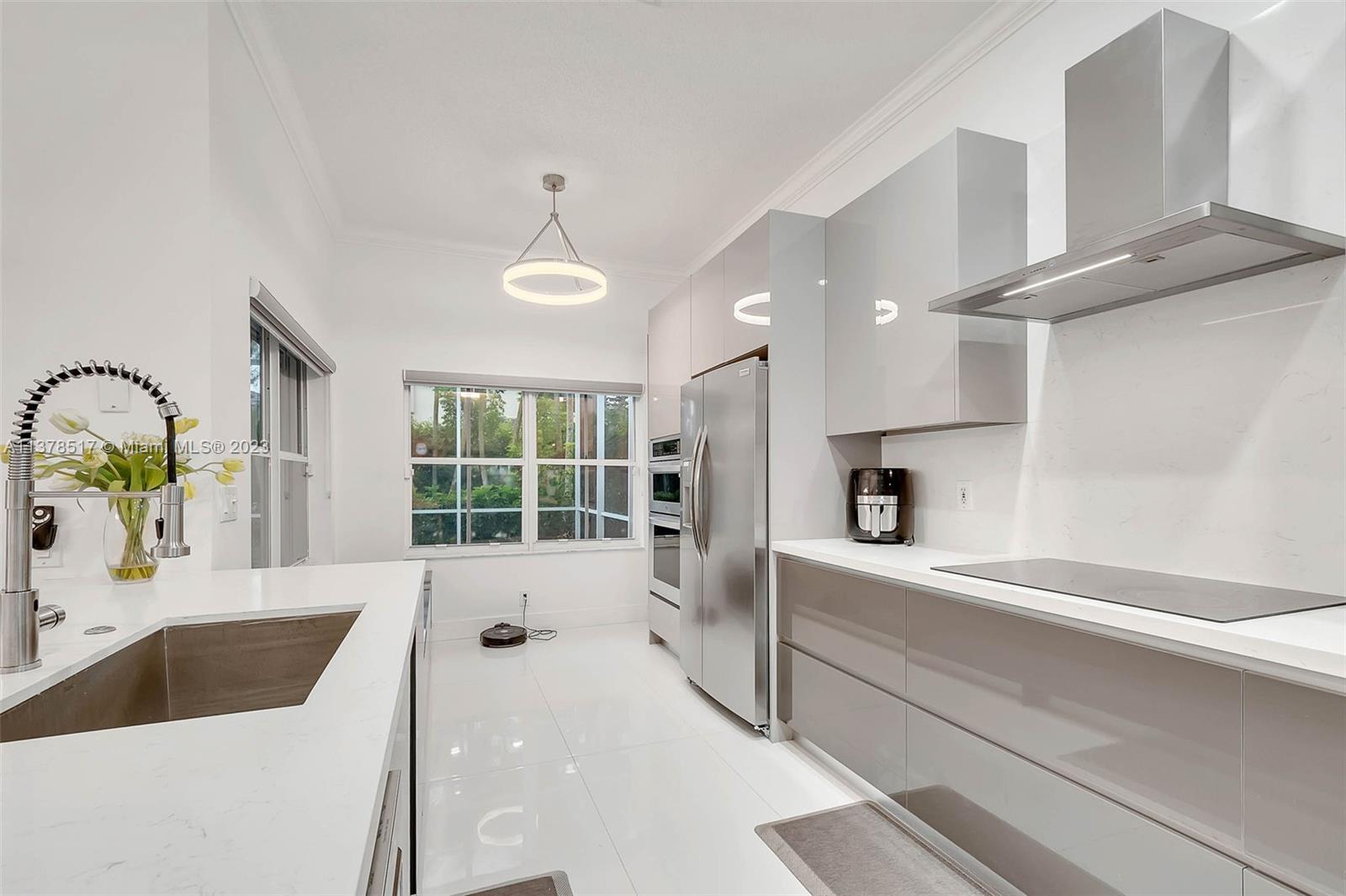 4115 Sabal Ridge Circle Weston, FL 33331 - Photo 5 of 31 a large white kitchen with a large window