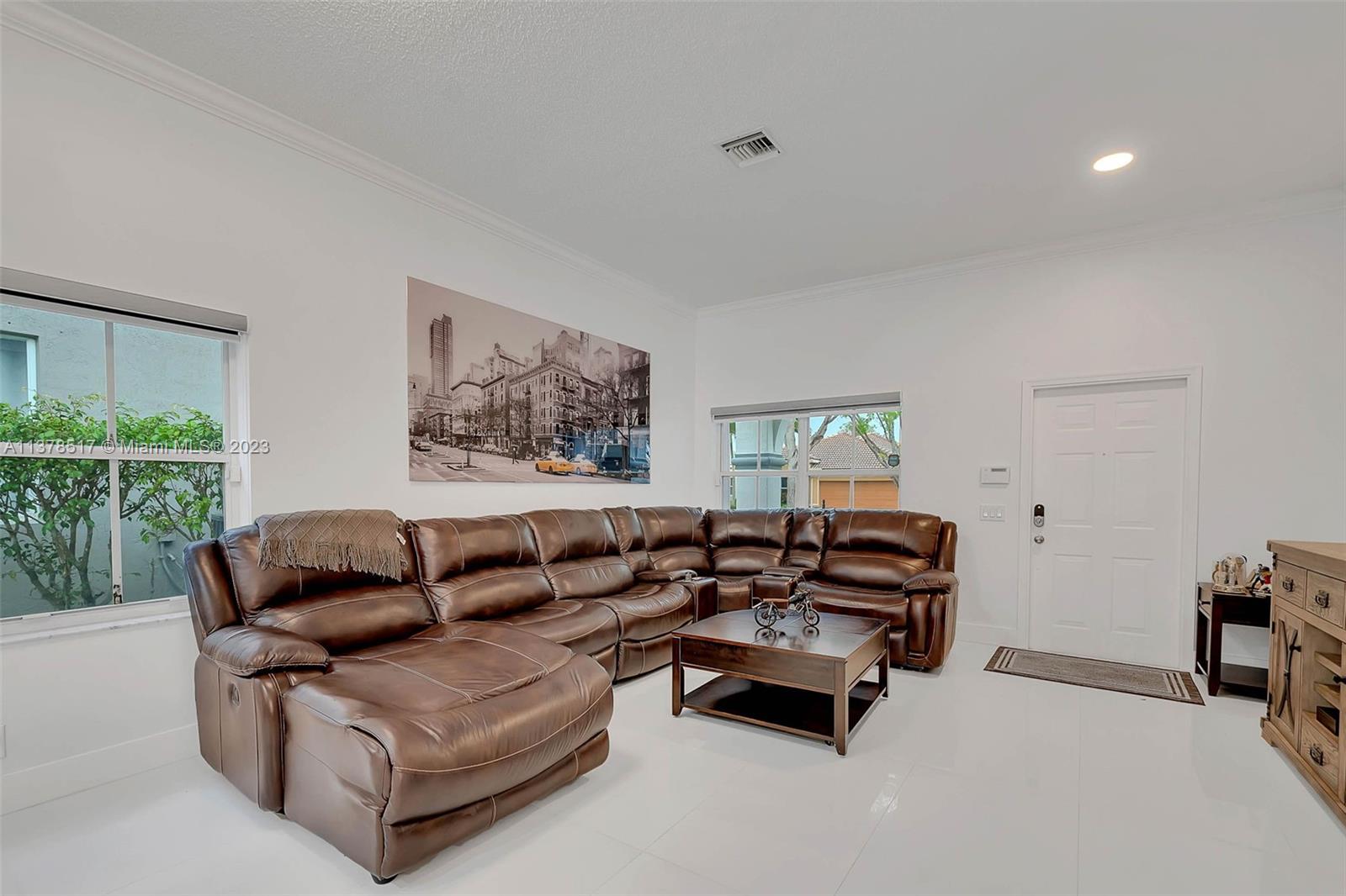 4115 Sabal Ridge Circle Weston, FL 33331 - Photo 10 of 31 a living room with furniture and a large window