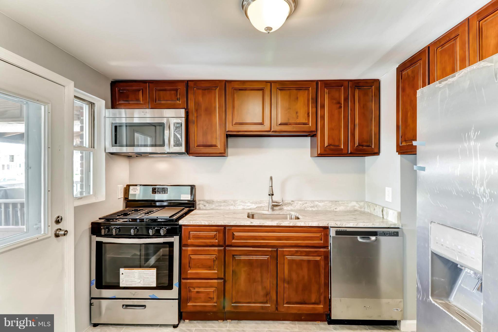 7396 Edsworth Road Baltimore, MD 21222 - Photo 6 of 17 Updated Kitchen w/ ss appliances