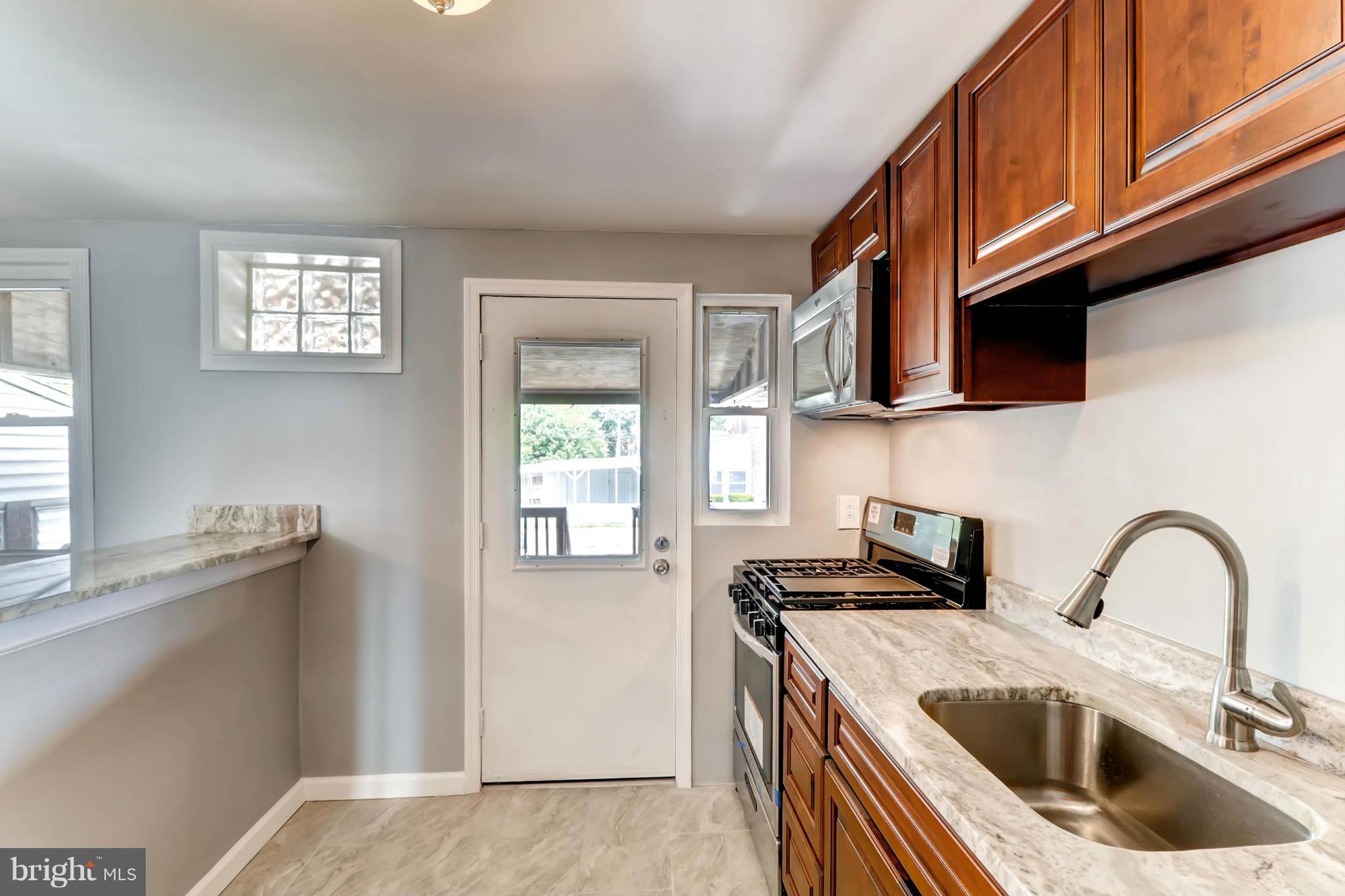 7396 Edsworth Road Baltimore, MD 21222 - Photo 7 of 17 Updated Kitchen w/ ss appliances